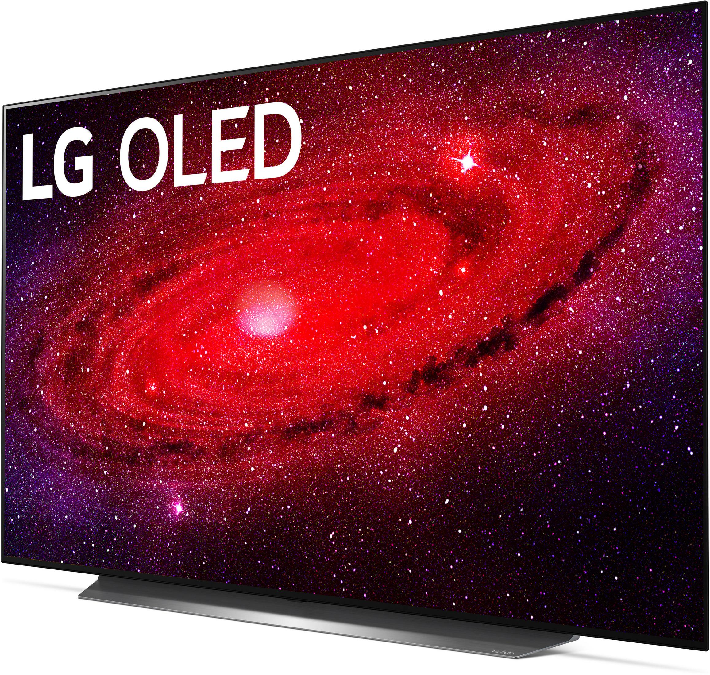 Telewizor LG OLED z czerwono-czarnym wyświetlaczem galaktyki. Srebrna podstawa.