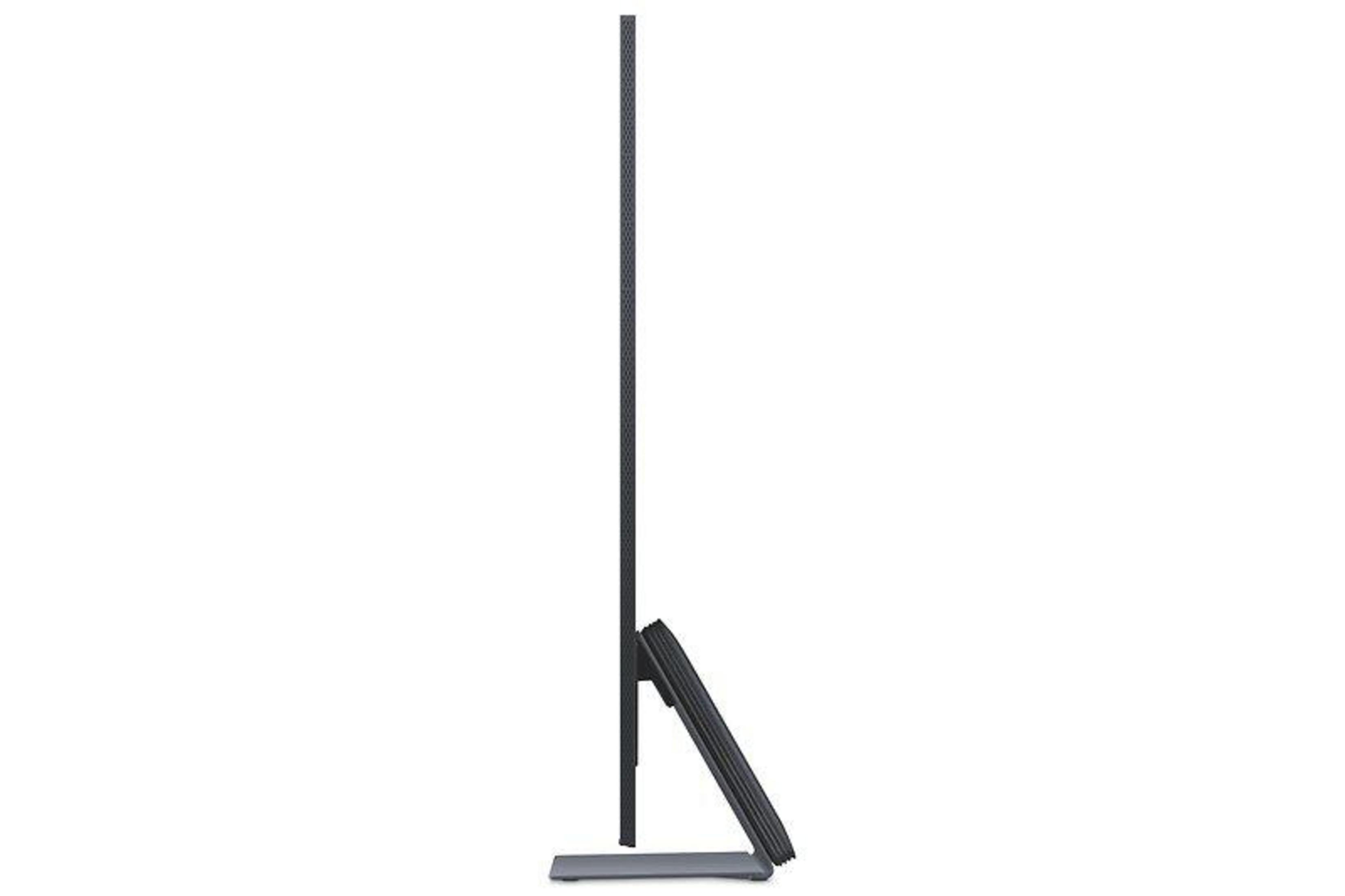 Widok z boku nowoczesnego, eleganckiego telewizora. Telewizor jest czarny, z cienką ramką i minimalistyczną podstawą.