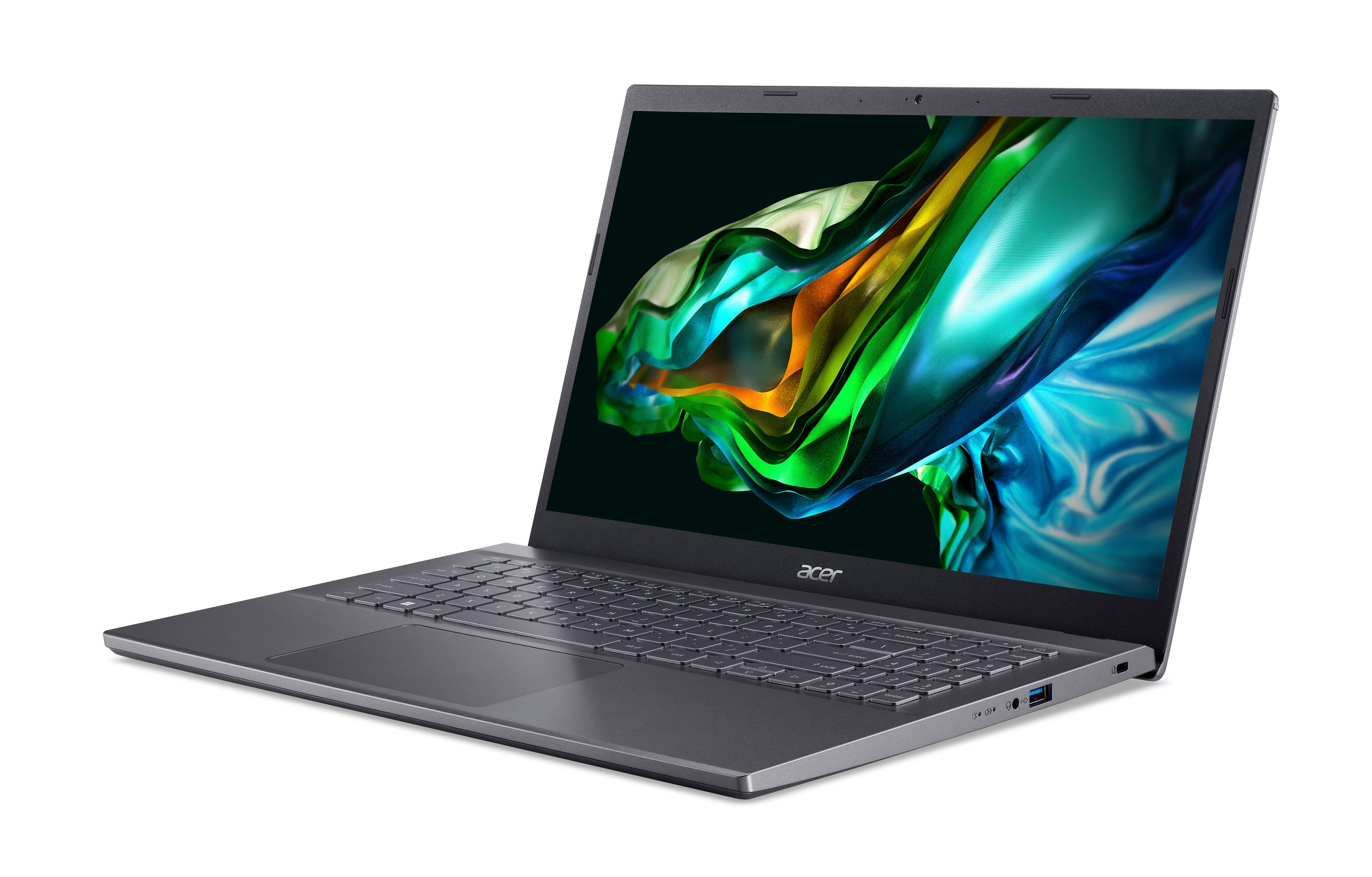 Ein grauer Acer Laptop auf weißer Oberfläche, schräge Ansicht.