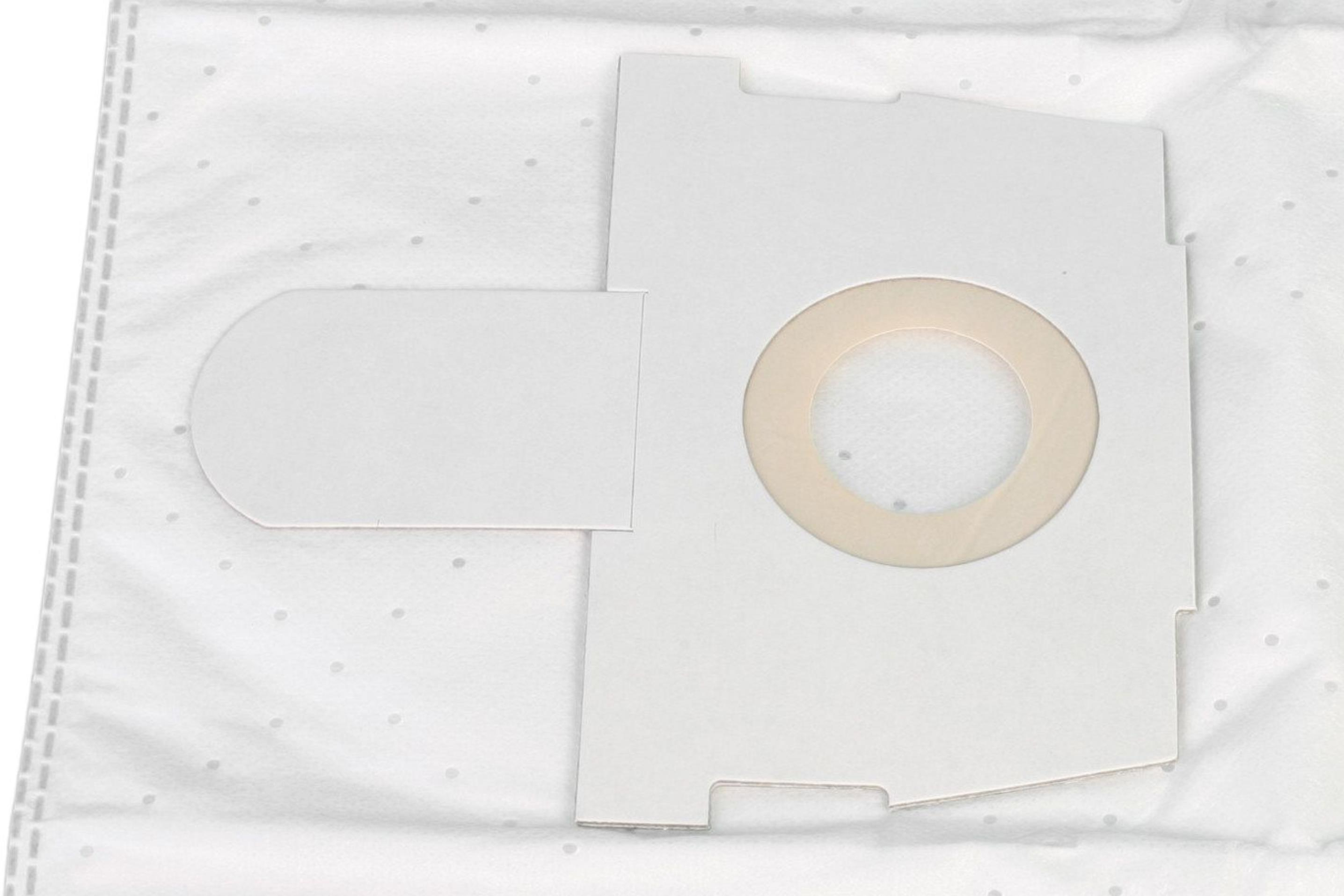 Weißer Papier-Staubsaugerfilter mit einem Kreisausschnitt auf einer gepunkteten weißen Oberfläche.