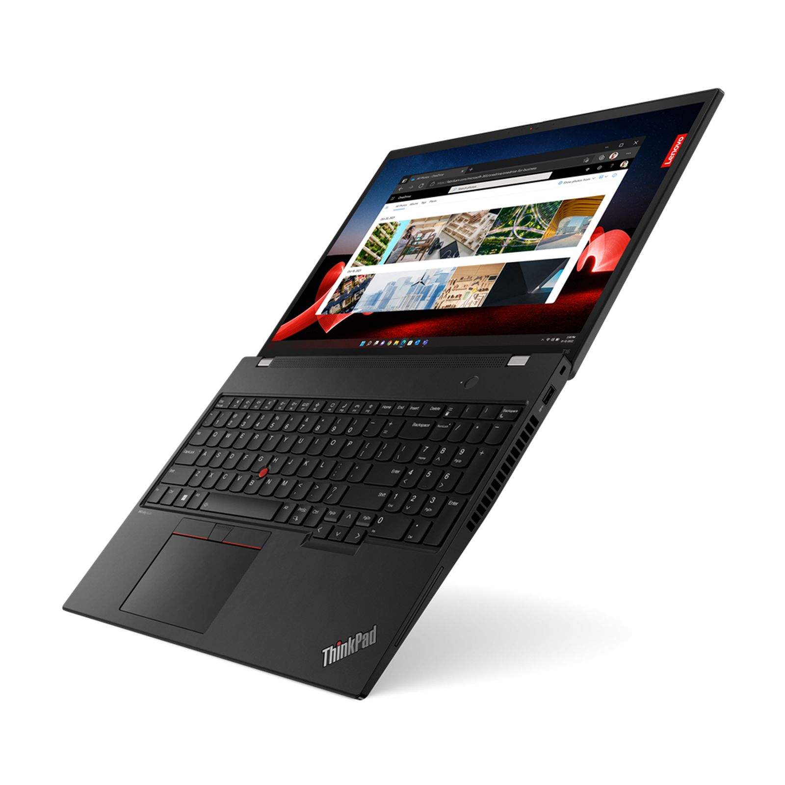 Laptop Lenovo ThinkPad nero su una superficie bianca, aperto con un sito web sullo schermo.