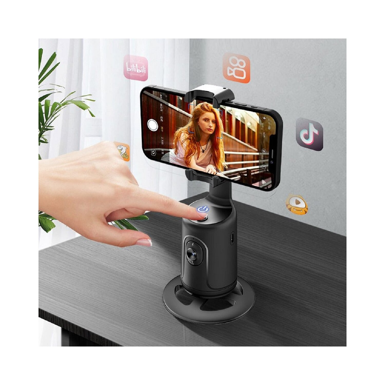 Eine Hand drückt eine Taste an einem schwarzen Telefonhalter mit einem Telefon, das eine Frau zeigt.