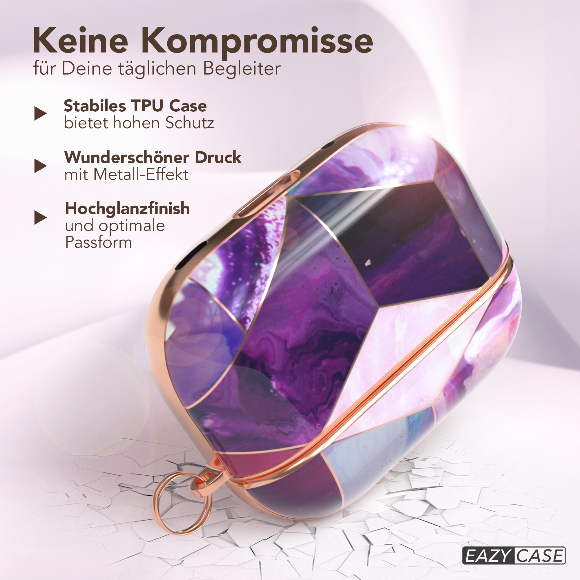 Lila-goldenes Schmucketui. Produkttext auf Deutsch.