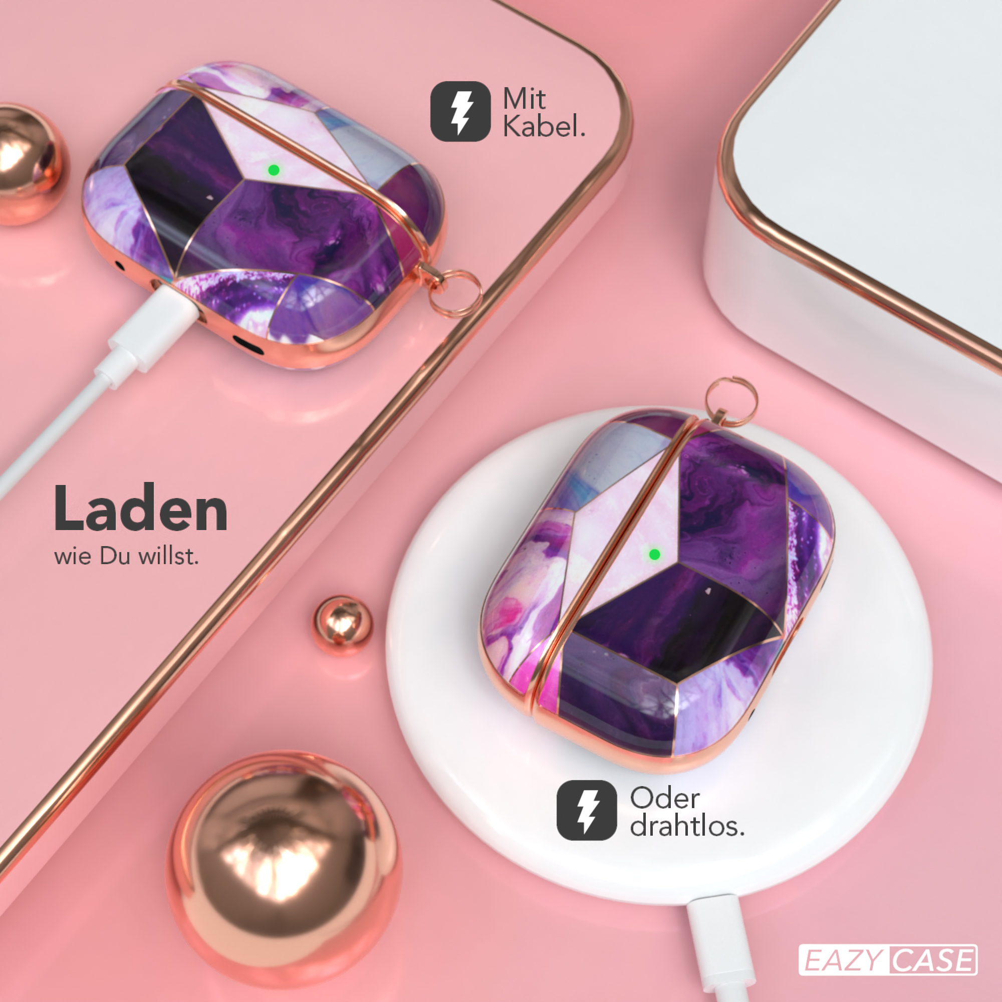 Kopfhörer-Etui mit Ladepad und Kabel. Rosa Hintergrund mit goldenen Akzenten.