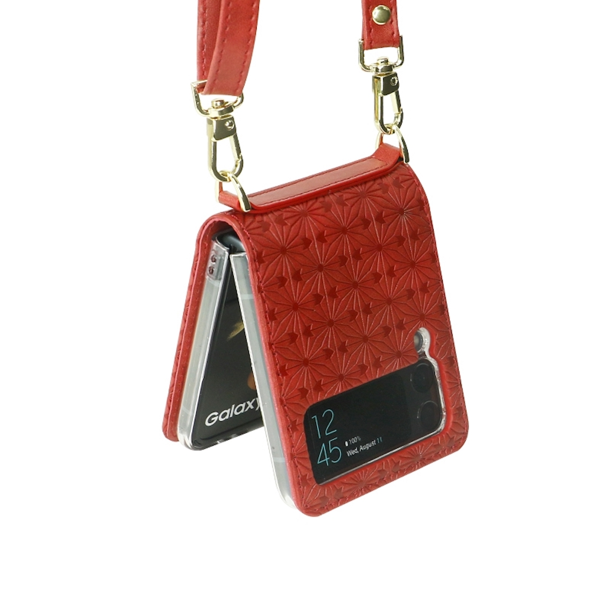 Rote Handytasche hängend. Die Tasche ist geöffnet und zeigt den Bildschirm des Telefons mit rotem Riemen und goldenen Verschlüssen.