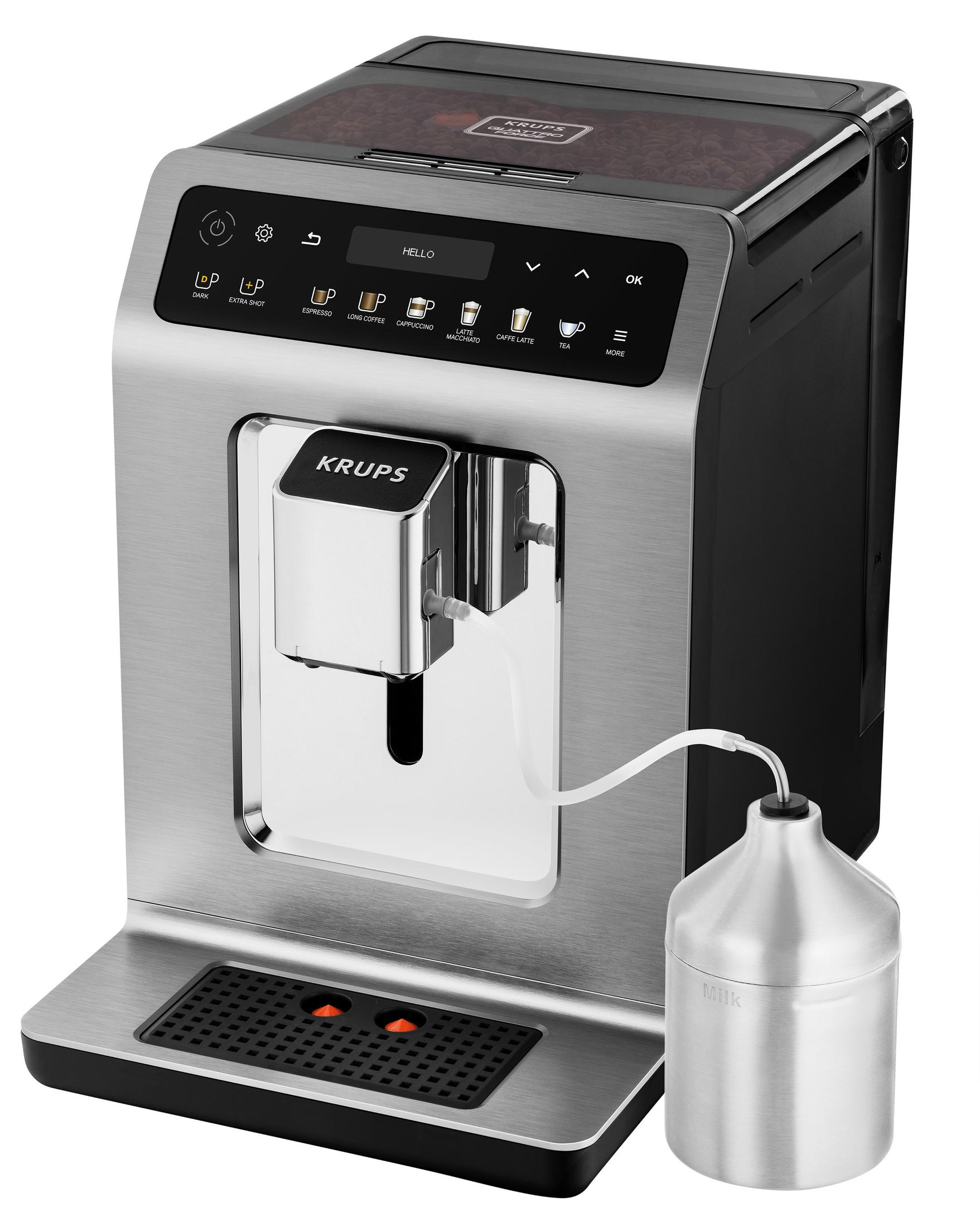 Cafetera Krups plateada y negra con un recipiente para leche. Varios botones y una pantalla.