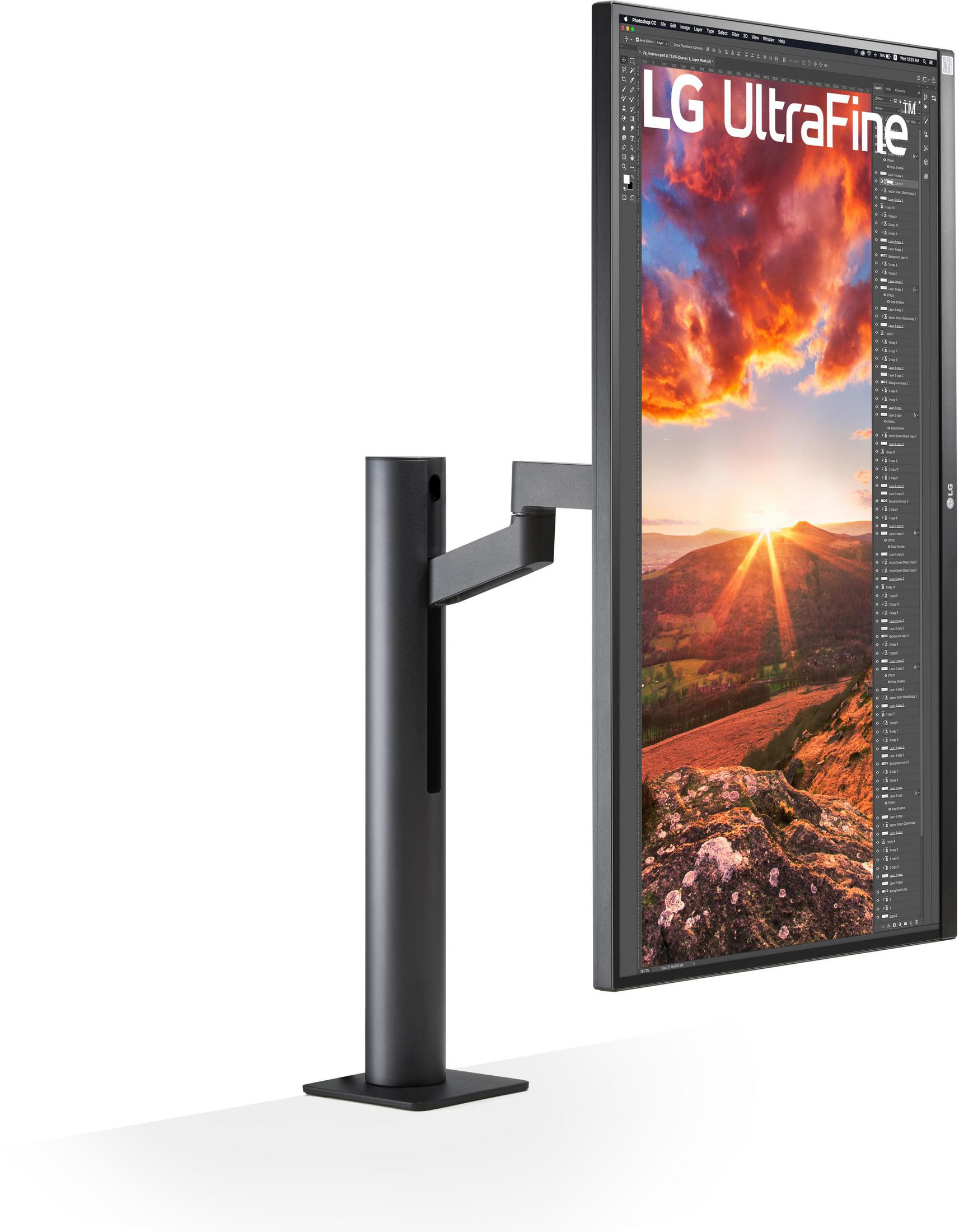 Monitor LG UltraFine, verticale. Lo schermo mostra un'immagine del tramonto. Il supporto è nero.