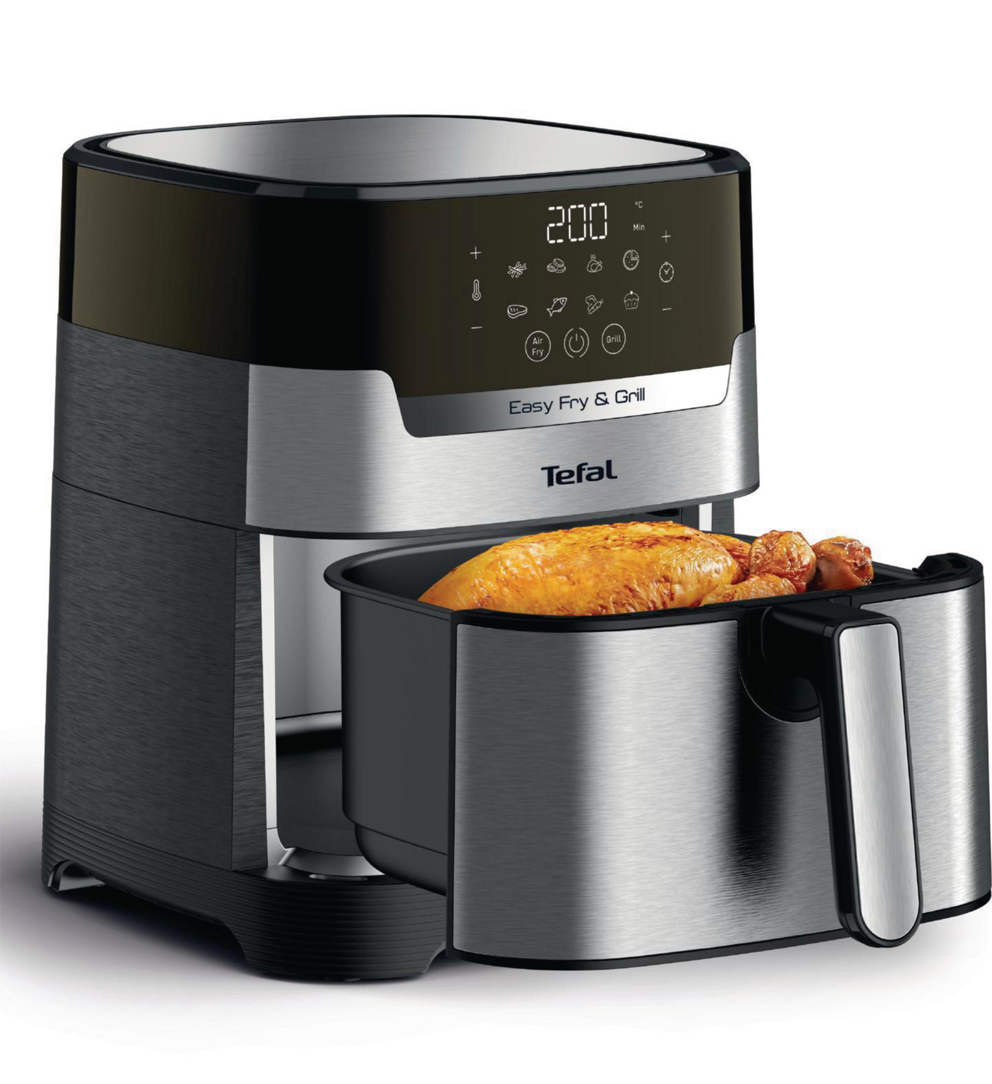 Tefal Easy Fry & Grill, czarny i srebrny, z kurczakiem wewnątrz tacy do gotowania.