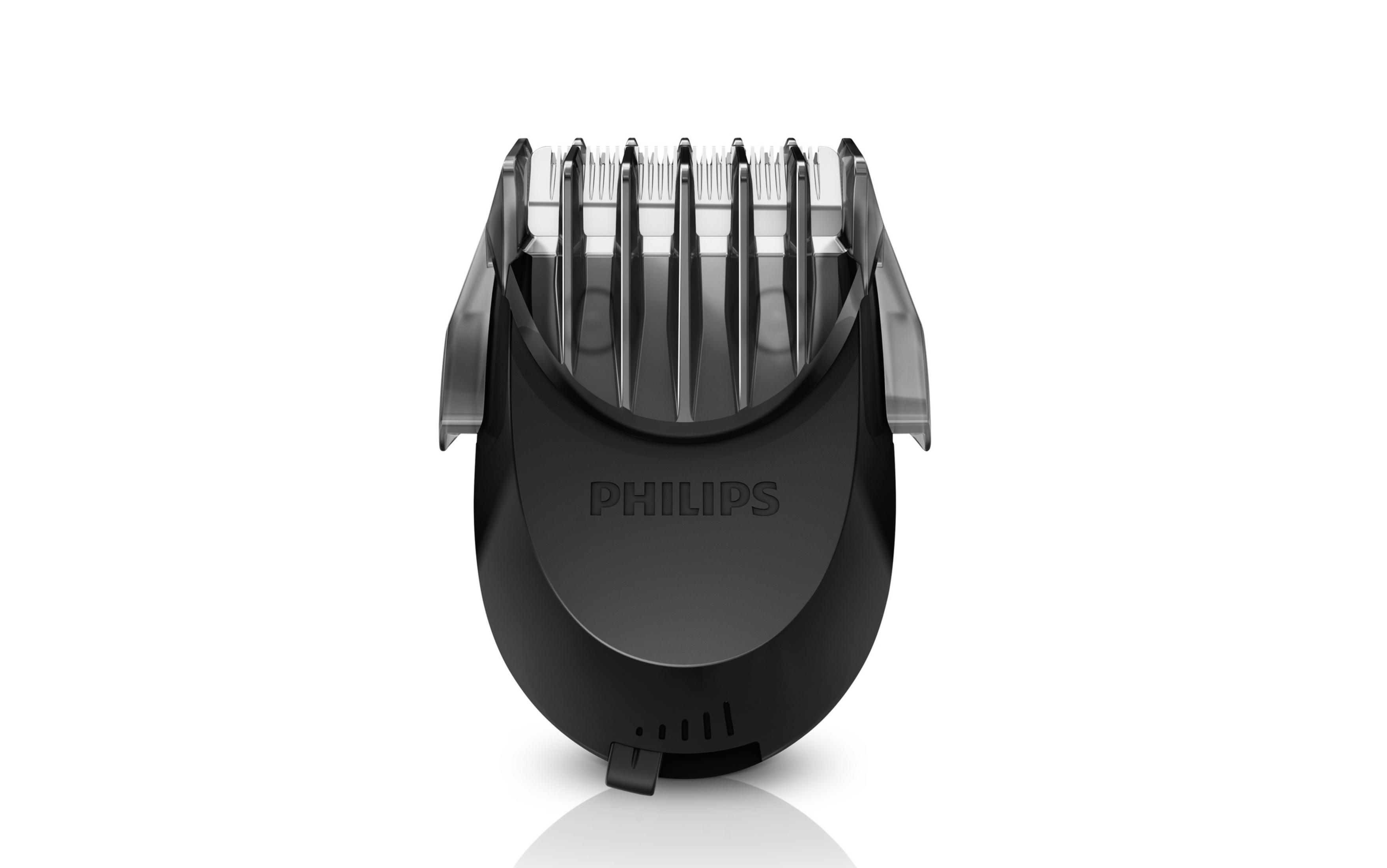 Siyah bir Philips sakal düzeltici başlığı, bıçakları ve ayar kadranı ile.