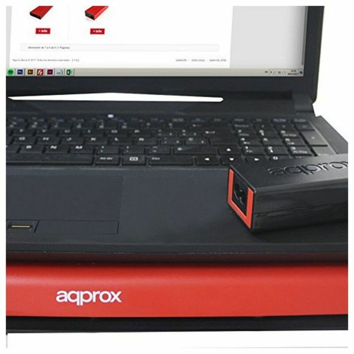 Portátil con carcasa negra y superficie roja. Un dispositivo negro con borde rojo está al lado.