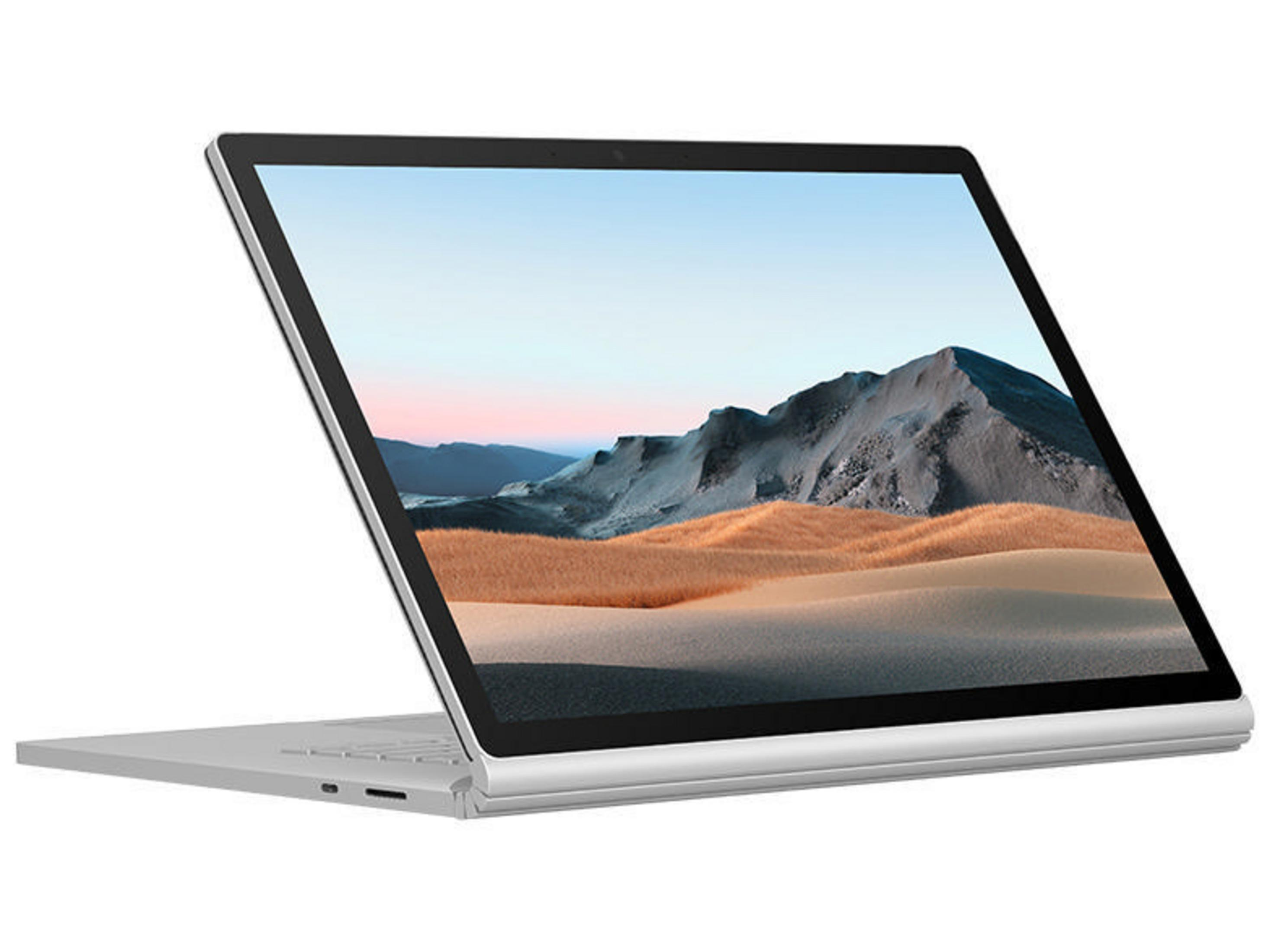 Silberner Laptop mit Landschaftsbild auf dem Bildschirm, angewinkelt geöffnet. Weißer Hintergrund.