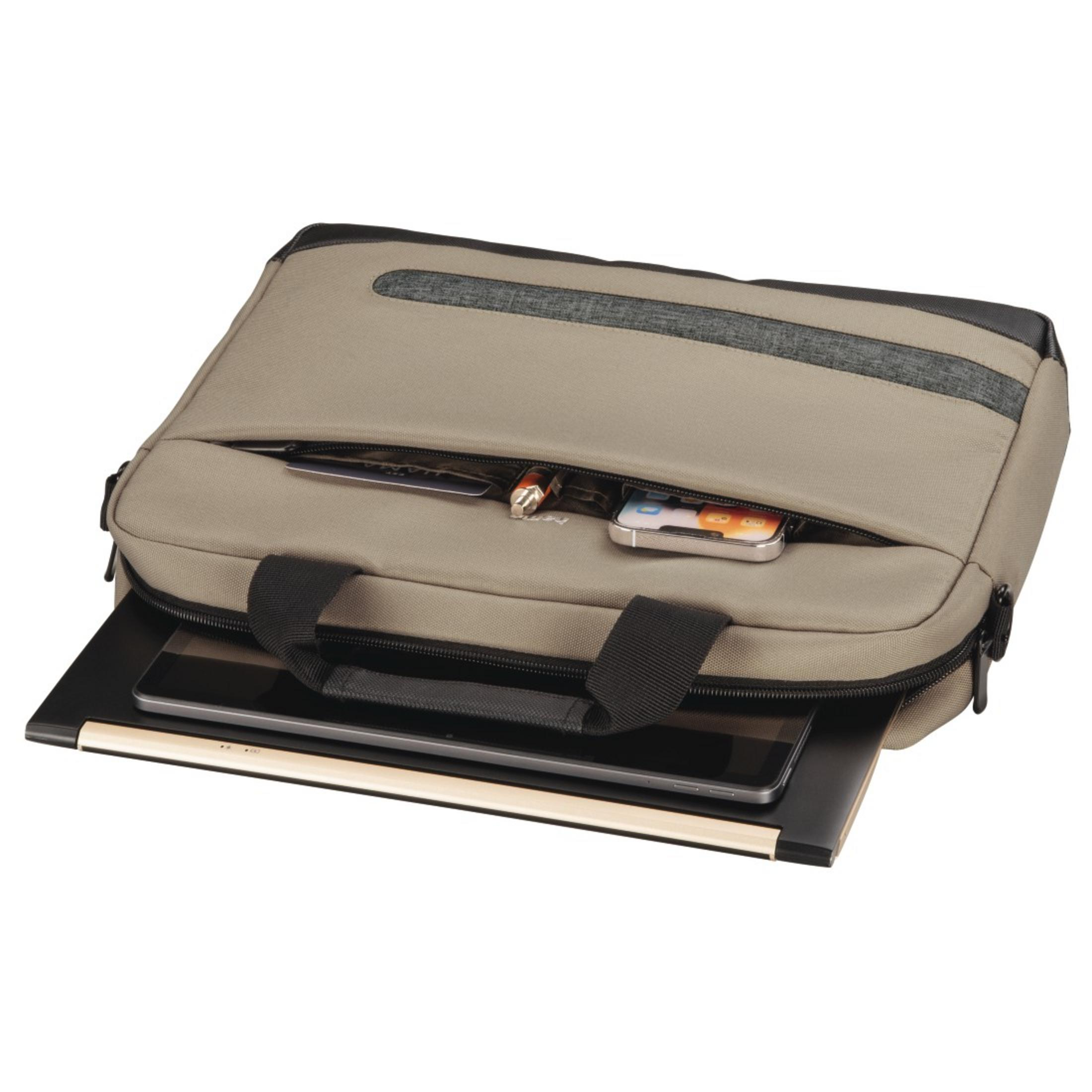 Otwarta torba na laptopa w kolorze piaskowym, mieszcząca laptopa, telefon, długopis i ładowarkę. Czarne uchwyty.