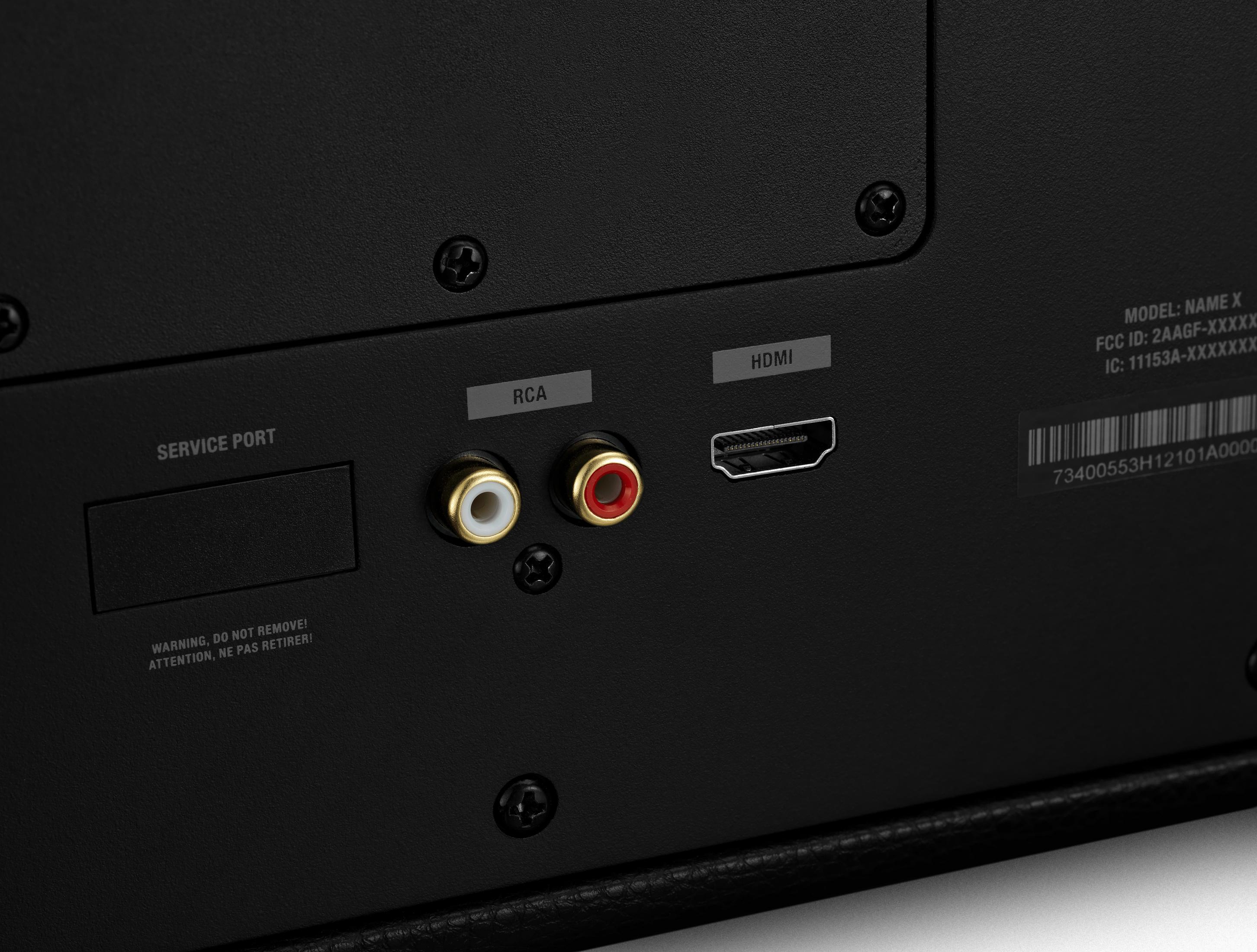 Rückseite eines schwarzen Lautsprechers mit RCA- und HDMI-Anschlüssen. Text: Serviceanschluss und Warnhinweise.