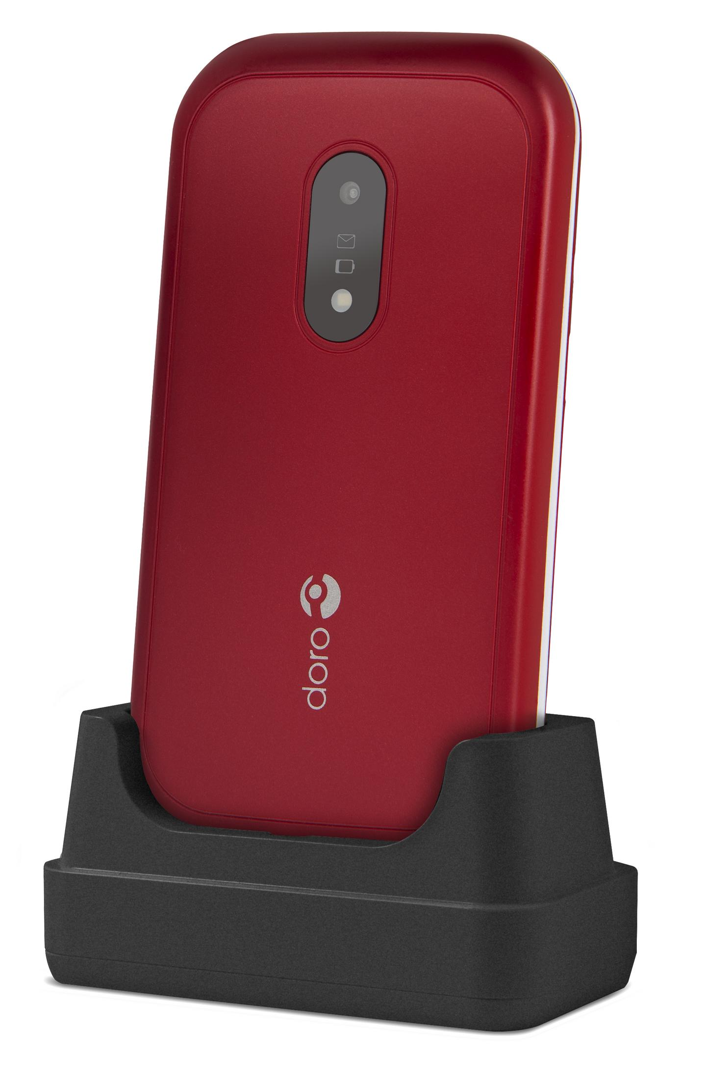 Teléfono Doro rojo en una base de carga negra. Tiene una cámara y el logotipo de Doro.