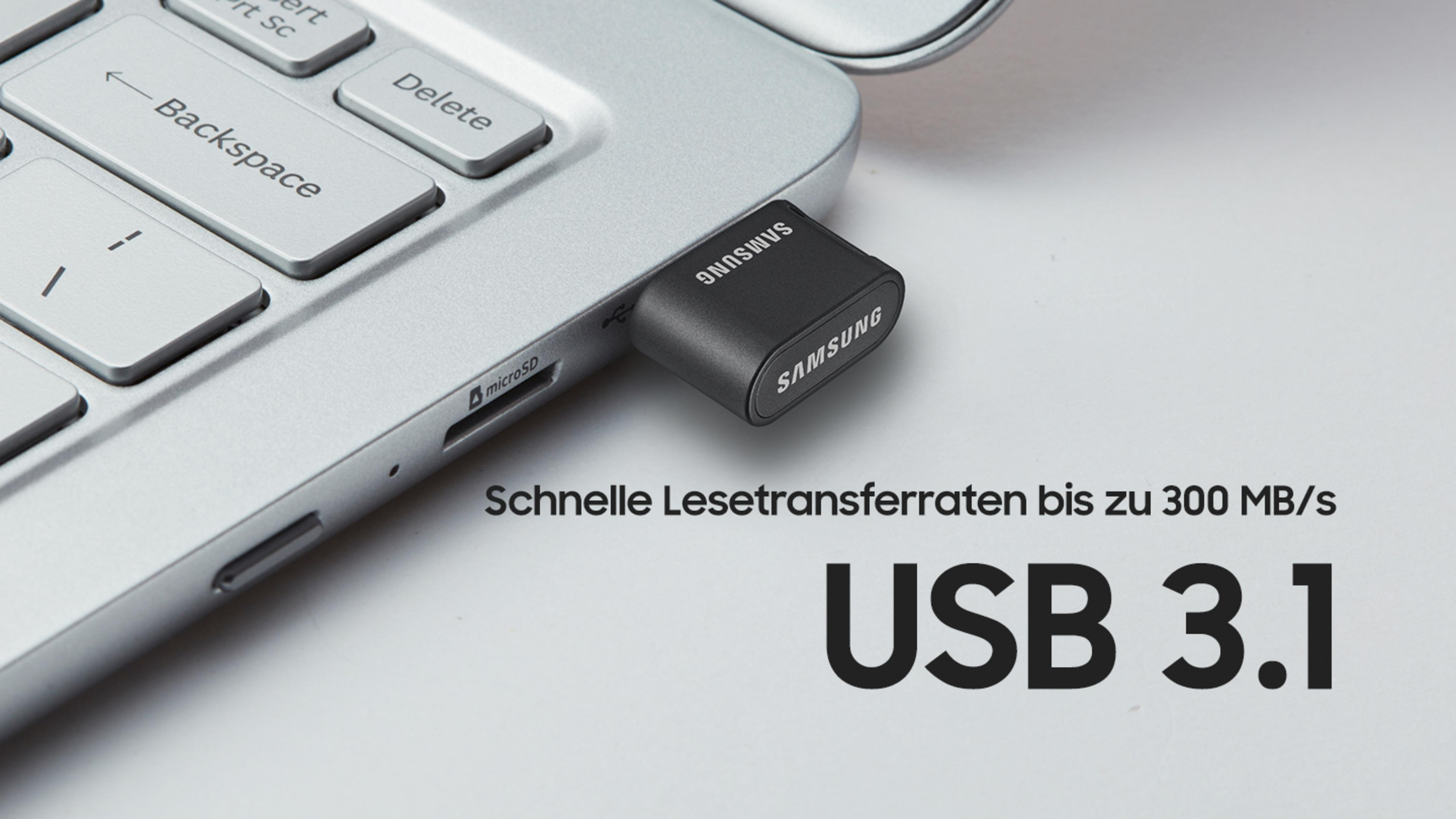 Una unidad flash USB 3.1 conectada a una laptop. Texto: Velocidades de transferencia de lectura rápidas hasta 300 MB/s