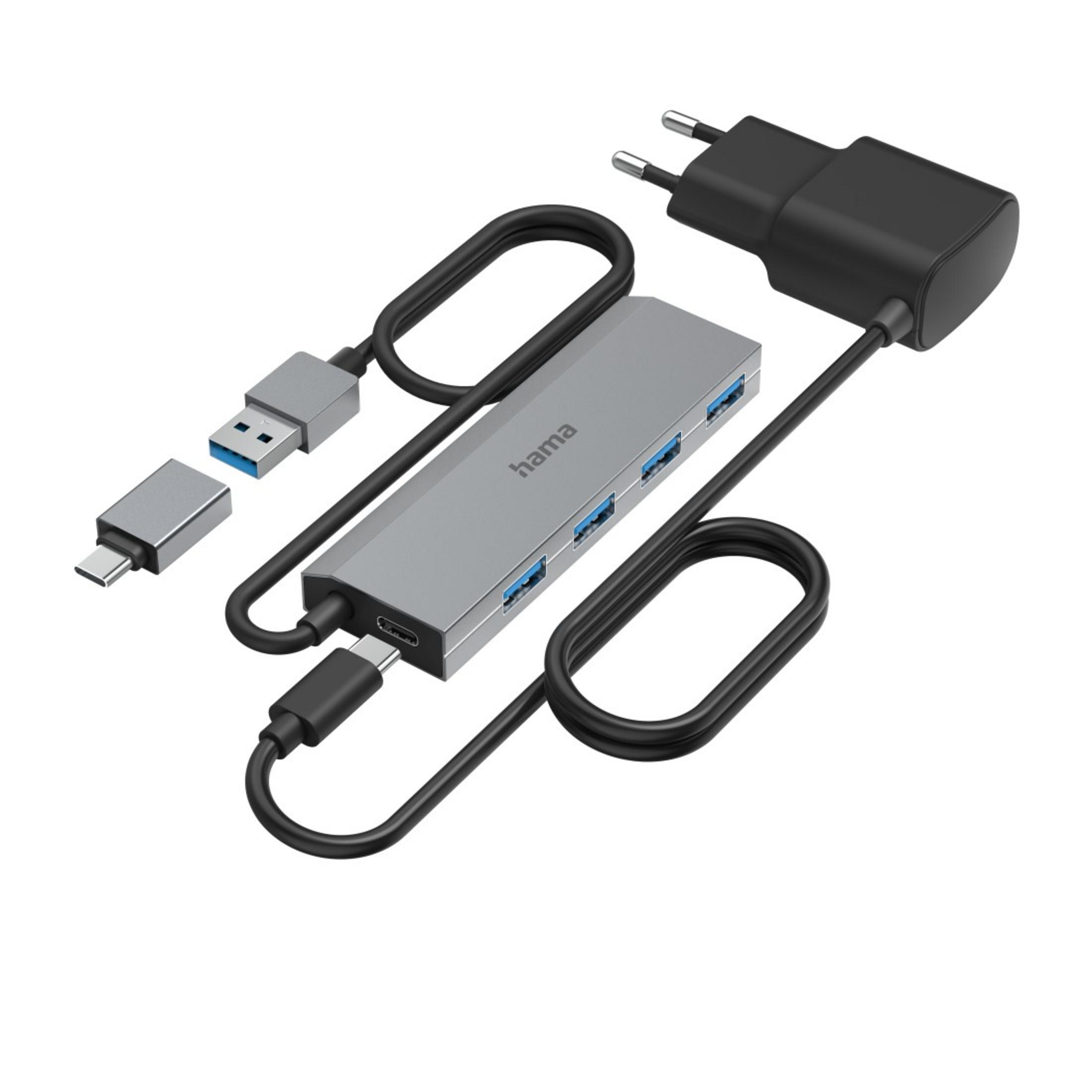 Un hub USB-C grigio con diversi connettori e un adattatore di alimentazione.