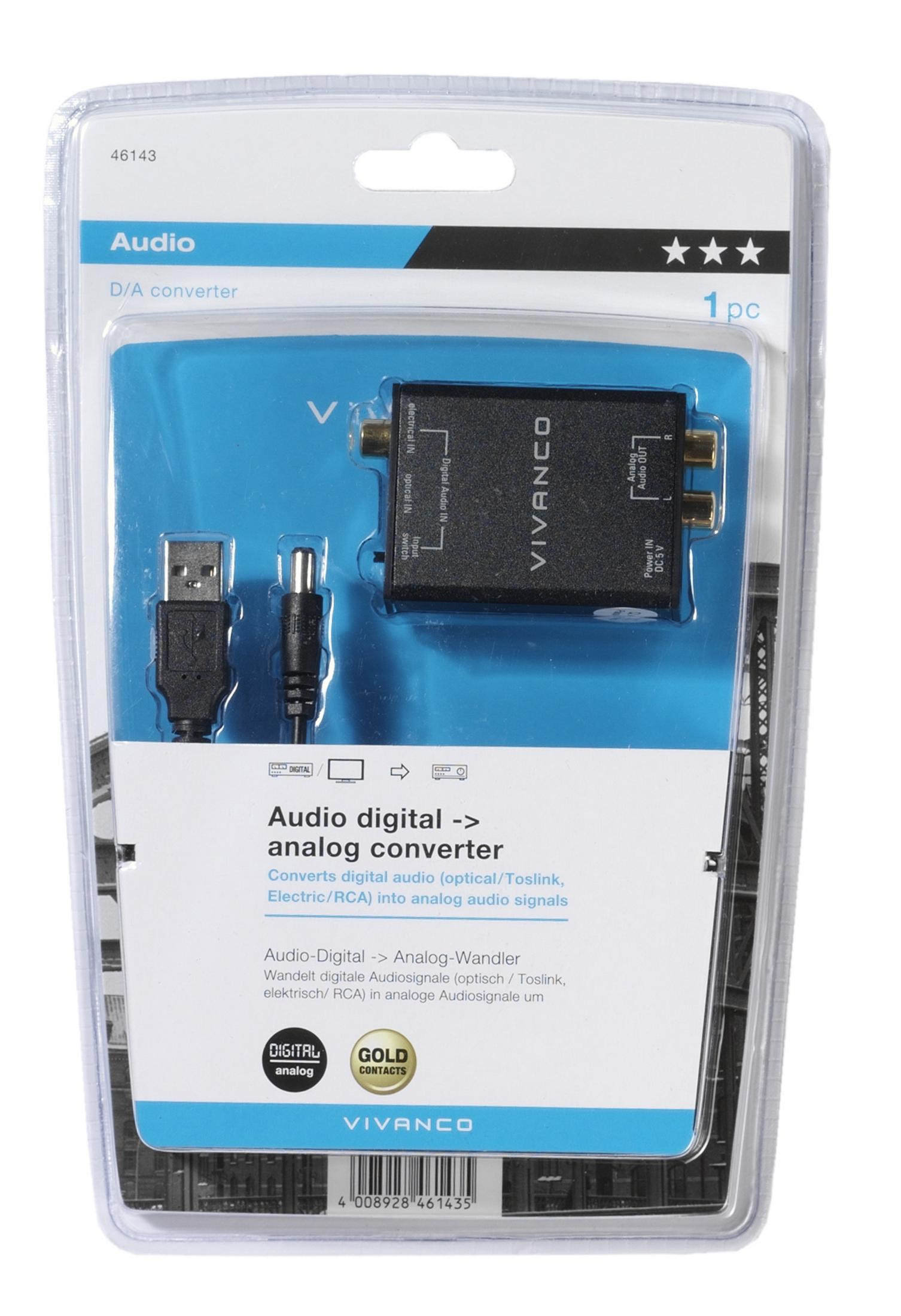 Convertidor digital a analógico de audio negro en un paquete de plástico. Cables USB y de alimentación adjuntos.