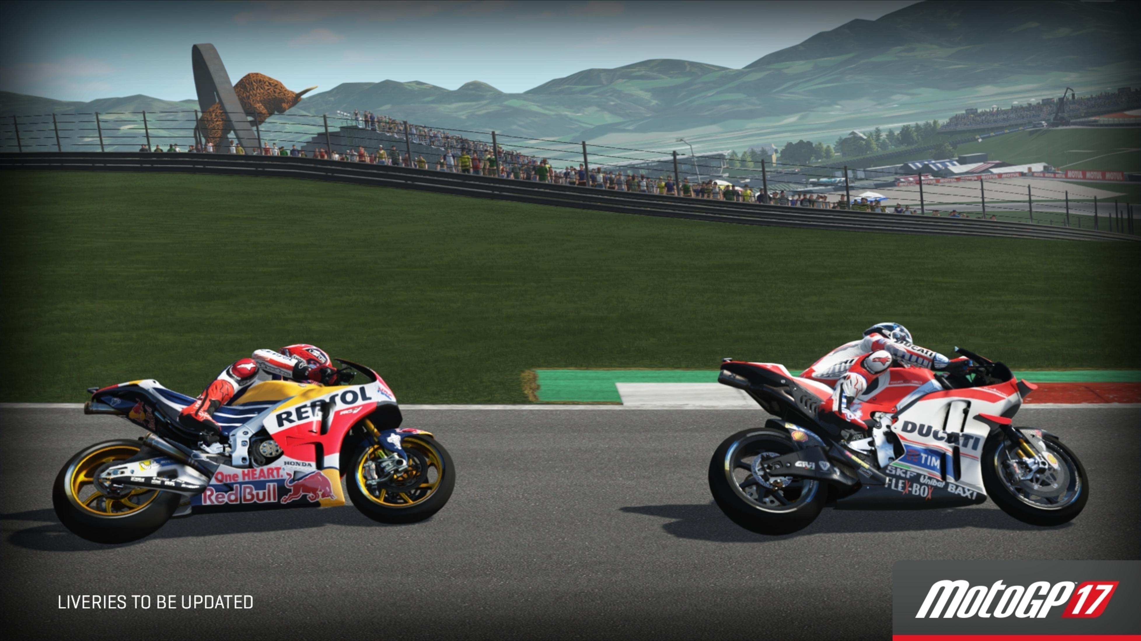 MotoGP 17 Spielcover. Zwei Motorräder auf der Rennstrecke. Grüne und graue Szenerie.