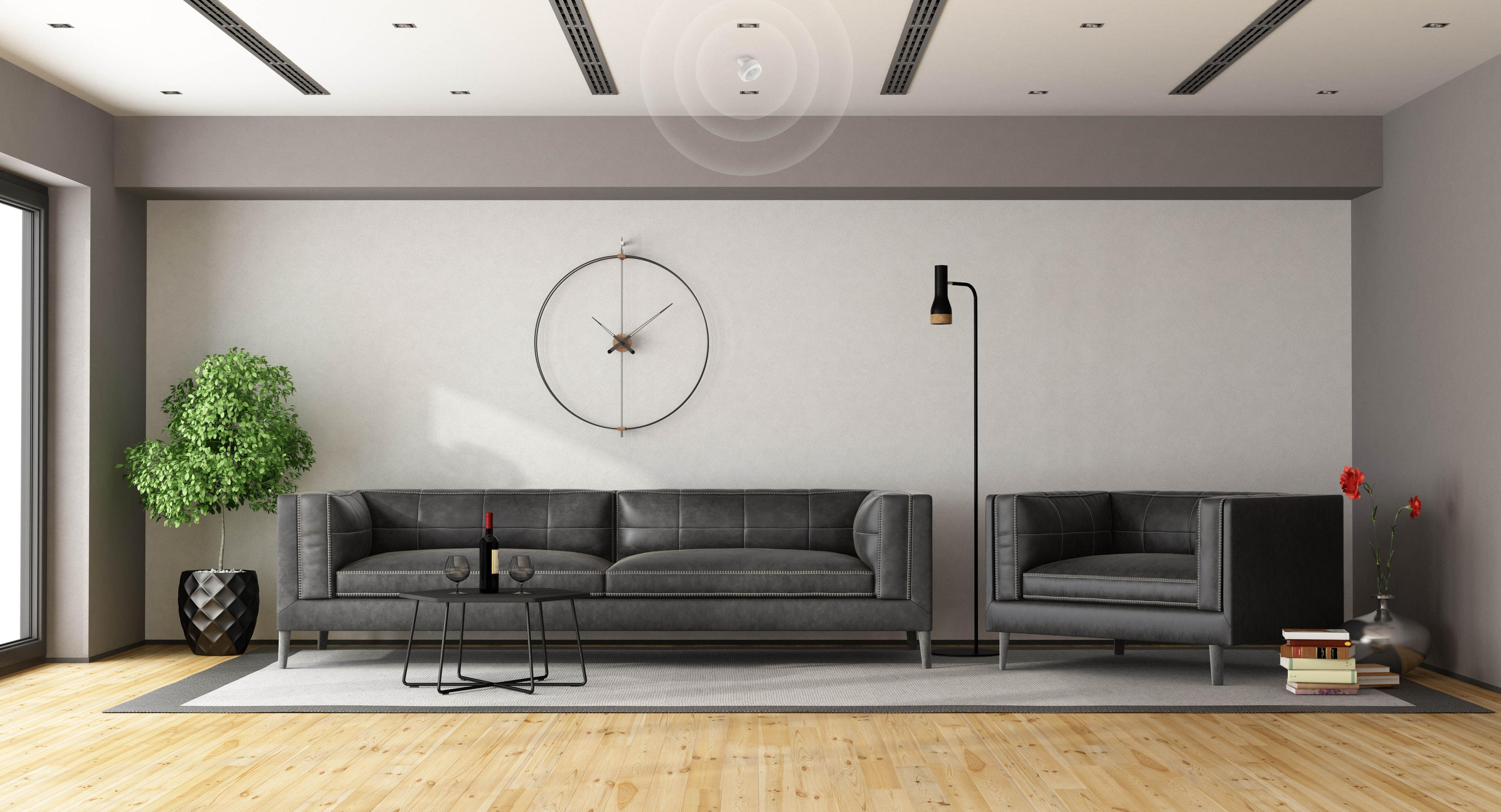 Modernes Wohnzimmer mit Sofa, Couchtisch und Pflanze.