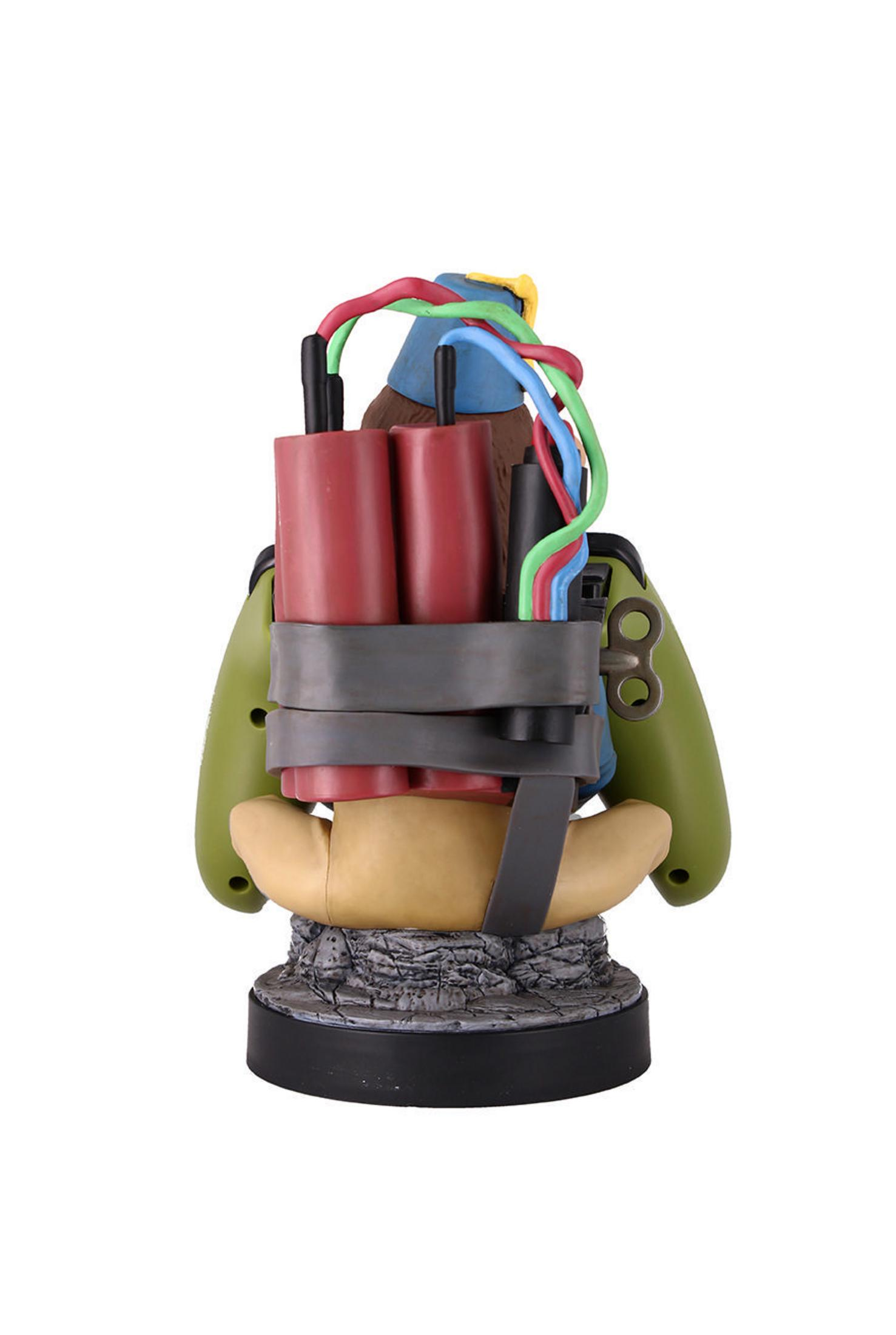Spielzeugfigur, die einer Bombe ähnelt. Rote, grüne und blaue Drähte sind sichtbar. Mit Controller-Griffen.