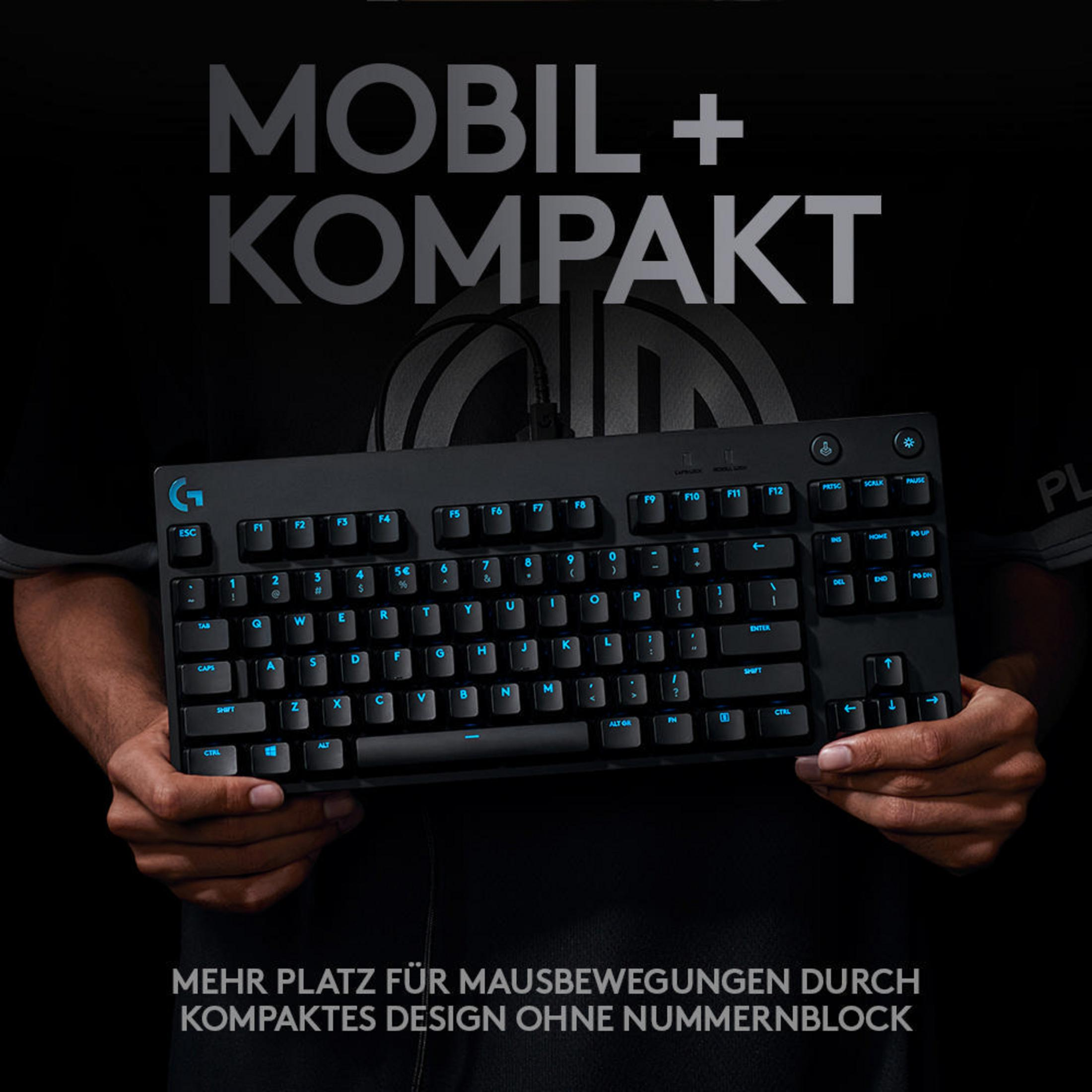 Czarna klawiatura gamingowa z niebieskimi klawiszami. Tekst: "Mobilny + Kompaktowy" i "Więcej miejsca na ruch myszy".