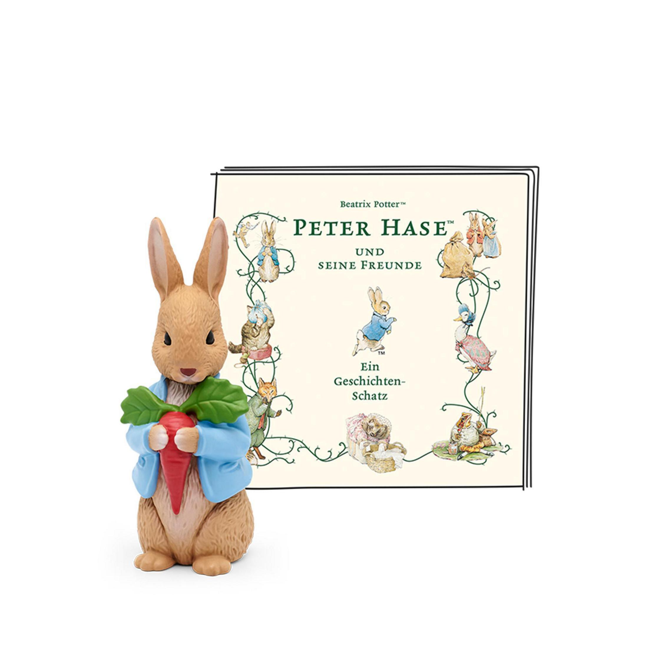 Peter Rabbit Buch und Figur. Hase mit Karotte, Buch mit Illustrationen, Beatrix Potter.