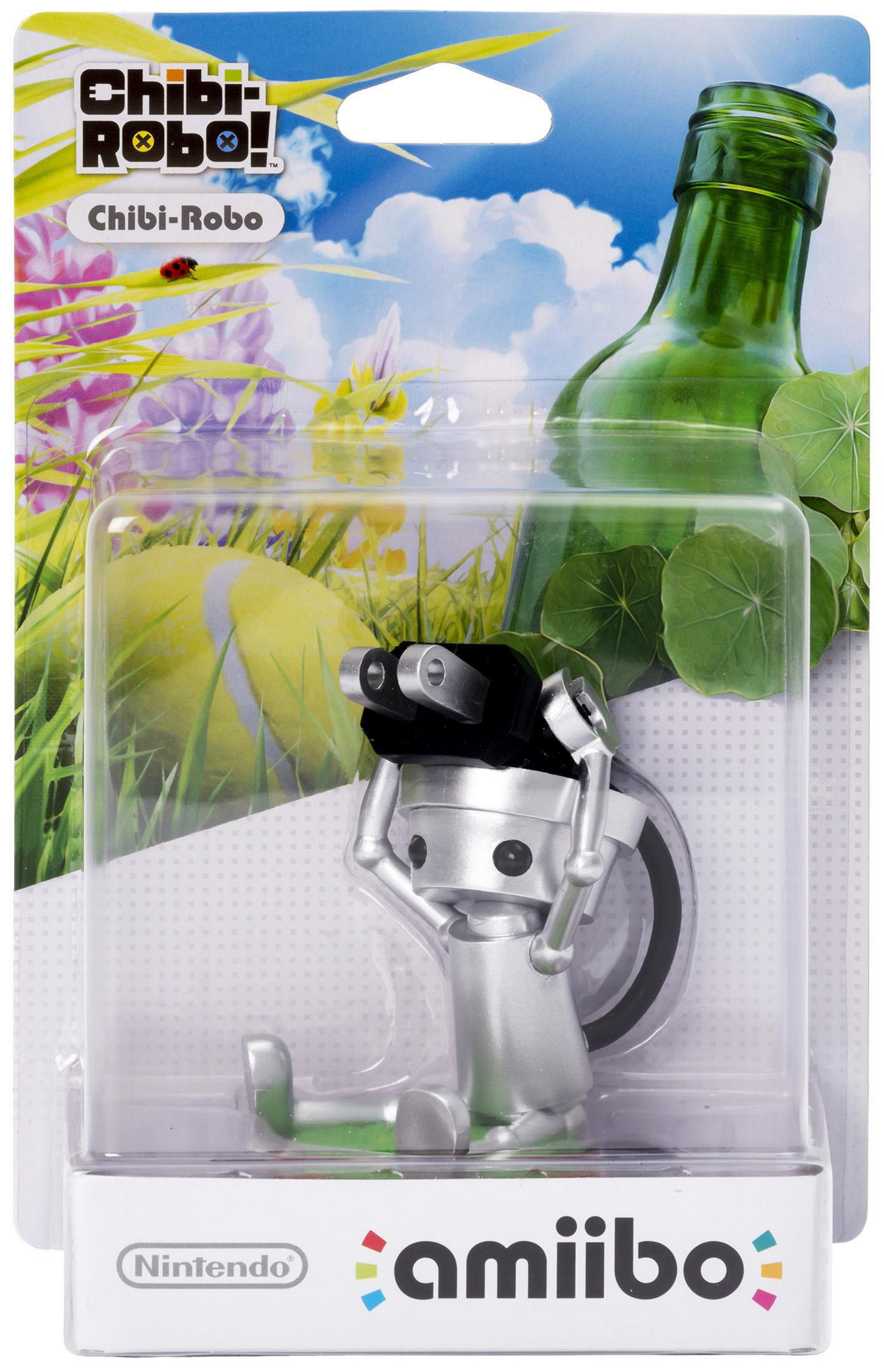 Chibi-Robo! Amiibo-Figur in einer Verpackung. Silberne Roboterfigur. Grüne Flasche im Hintergrund.