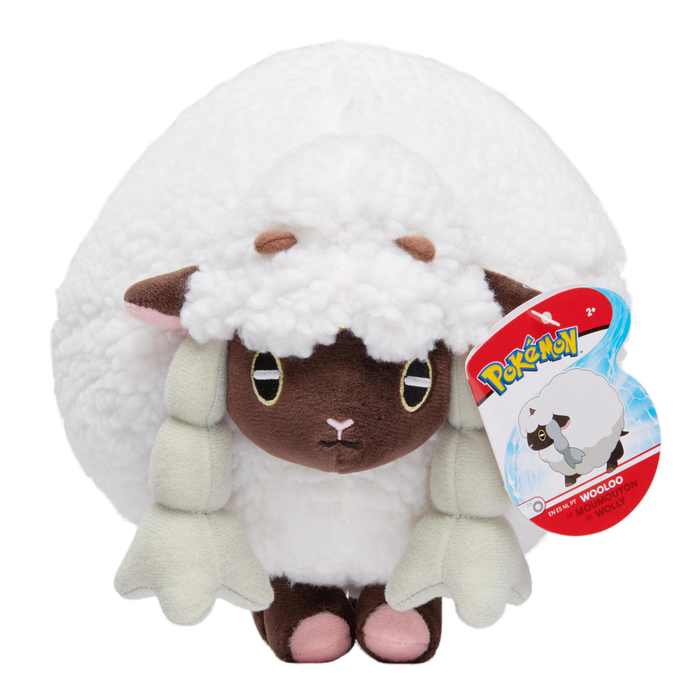 Ein Wooloo Pokémon-Plüschtier mit weißem Körper, braunem Gesicht und kleinen Hörnern, mit einem Anhänger.