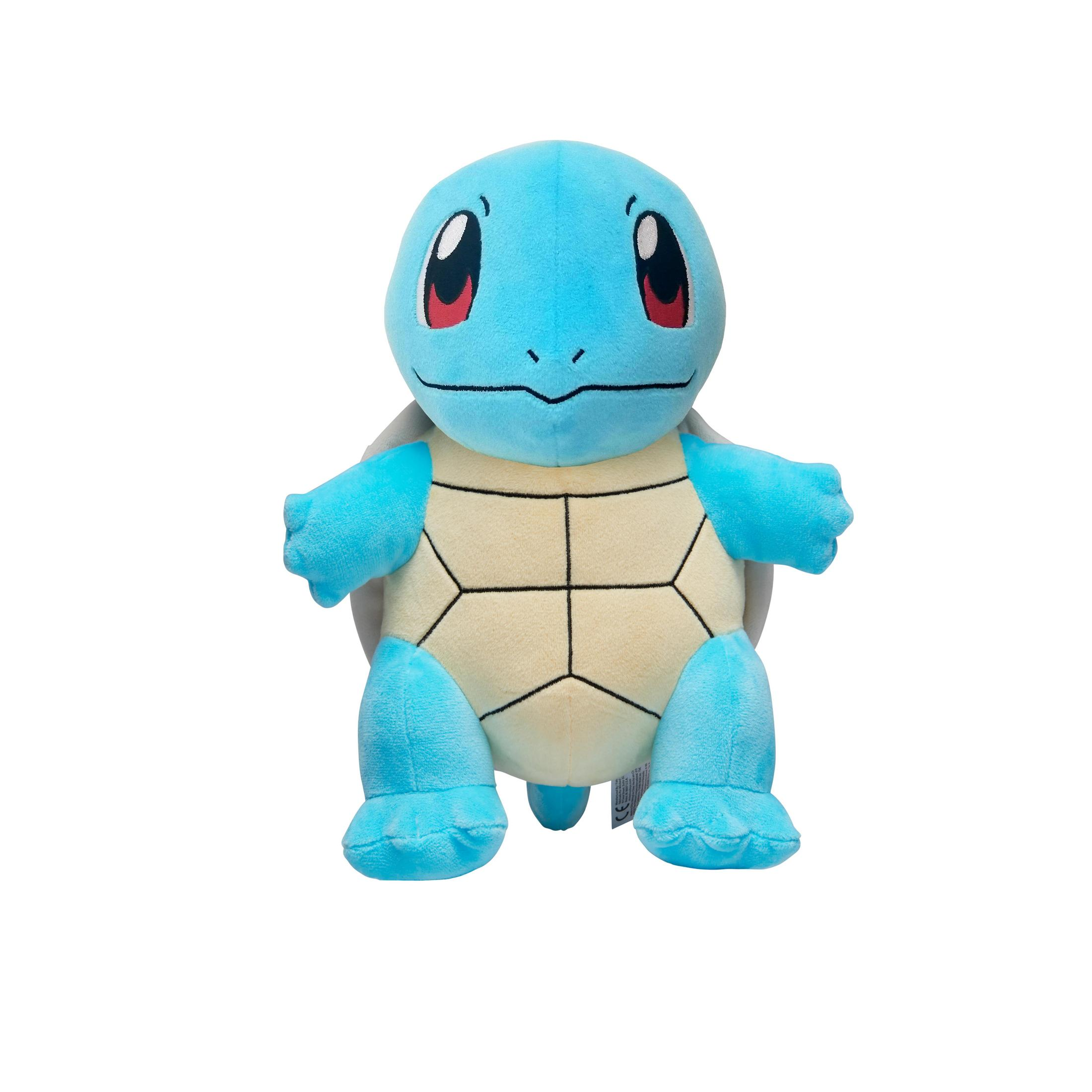 Blaues Squirtle-Plüschtier steht auf Weiß. Es hat rote Augen und einen beigen Panzer.