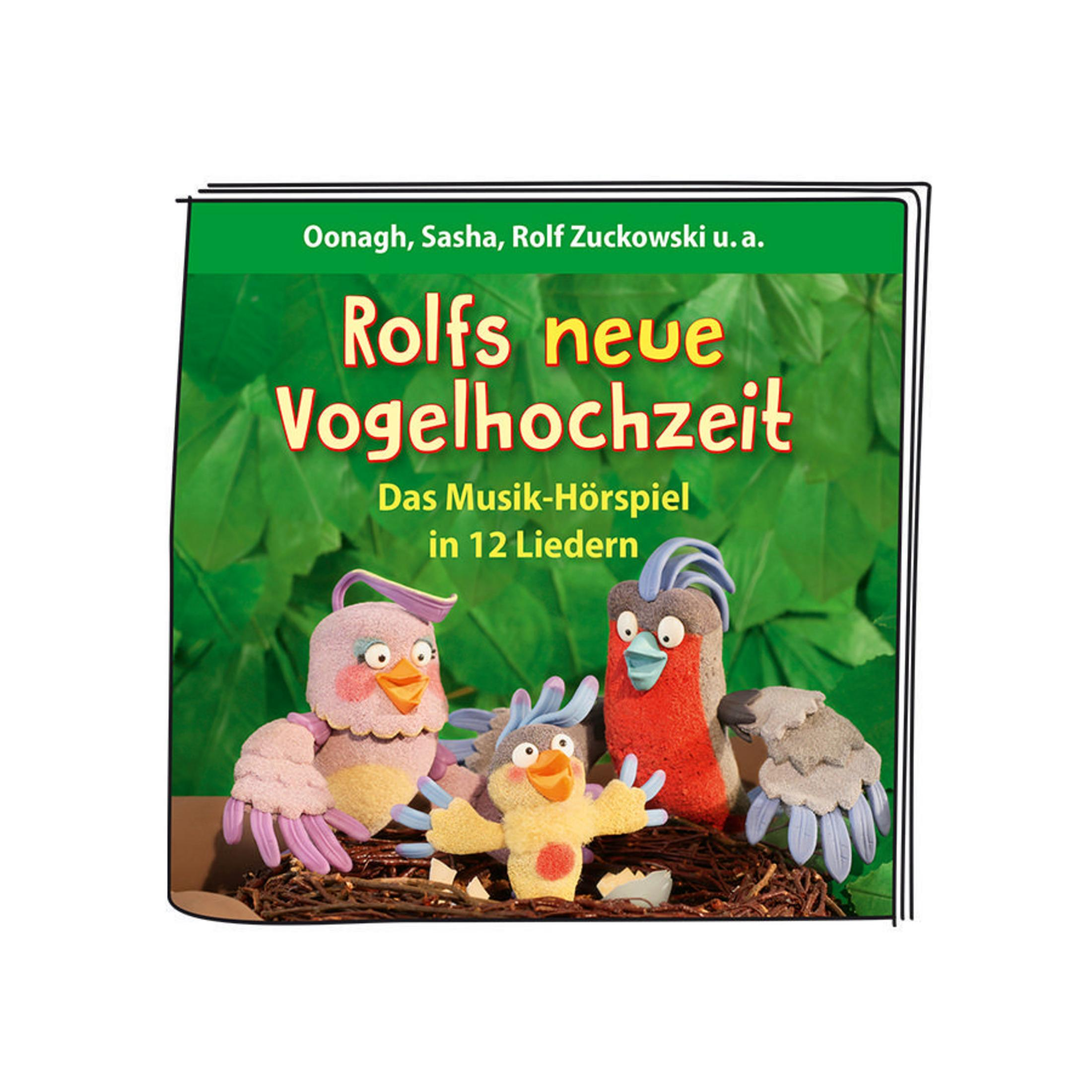 Ein Buchcover mit dem Titel 'Rolfs neue Vogelhochzeit'. Auf dem Cover sind drei Vogelspielzeuge abgebildet.