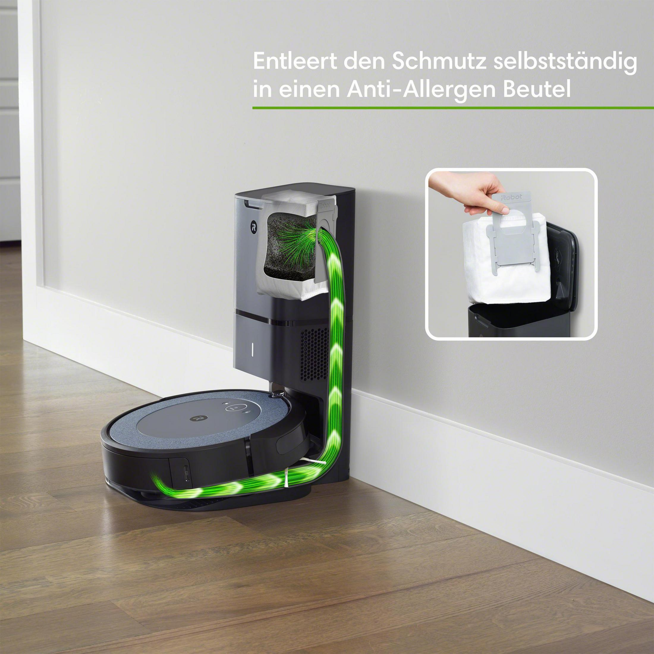 Ein Roboter-Staubsauger mit Ladestation. Der Staubsauger ist schwarz, die Station grau.