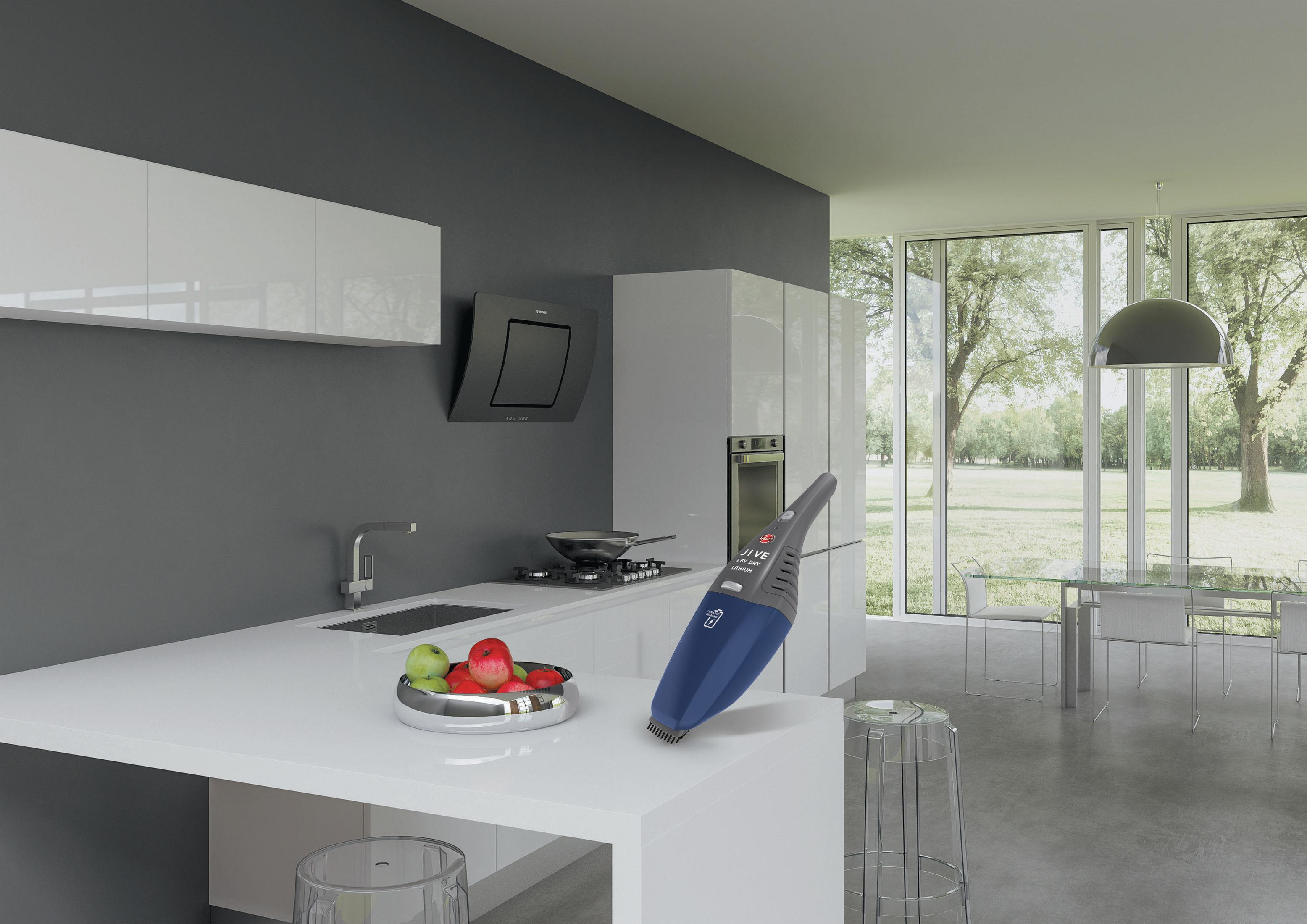 Cocina moderna con una aspiradora en la encimera.