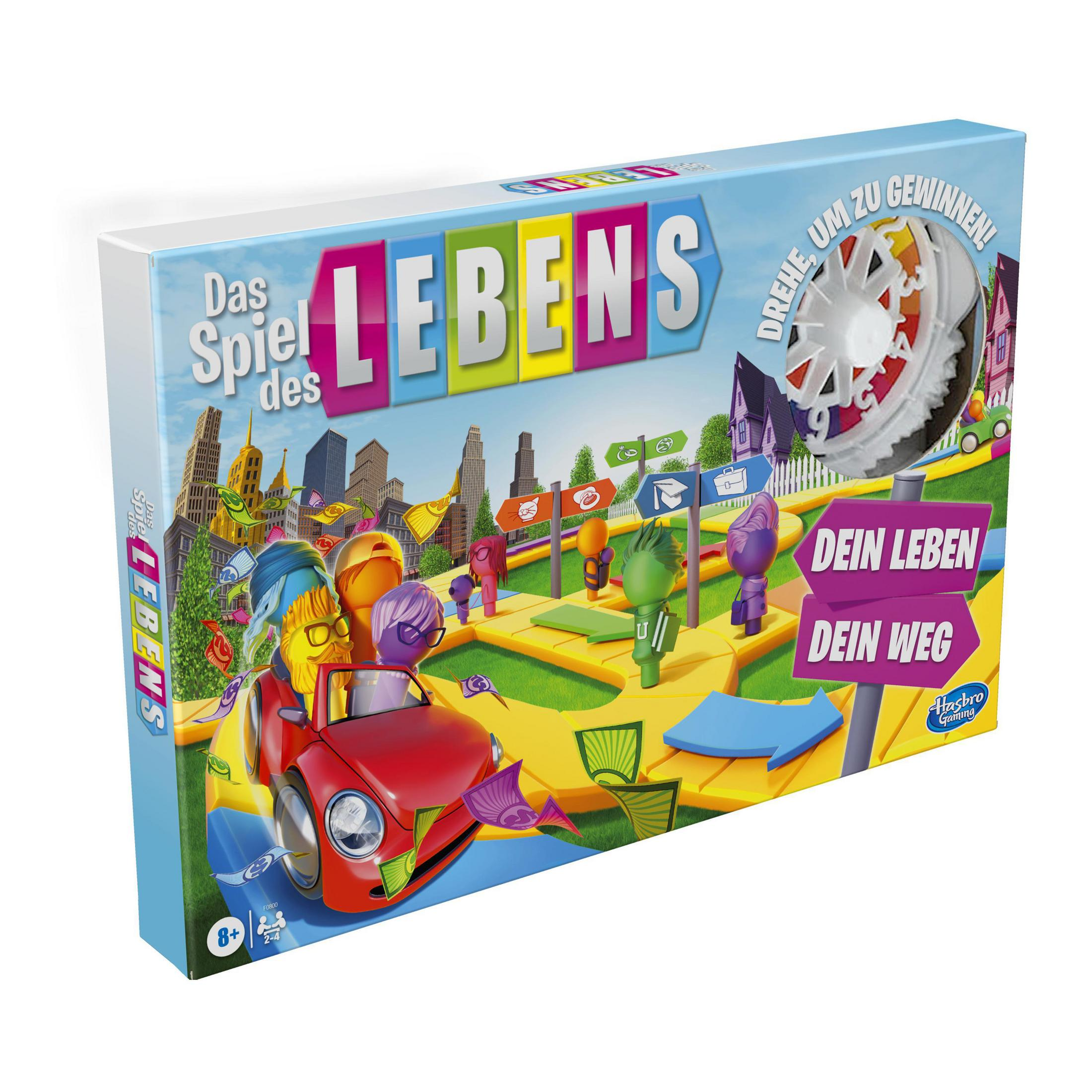 Spielbox mit rotem Auto auf einer Straße. Das Spiel heißt Das Spiel des Lebens.