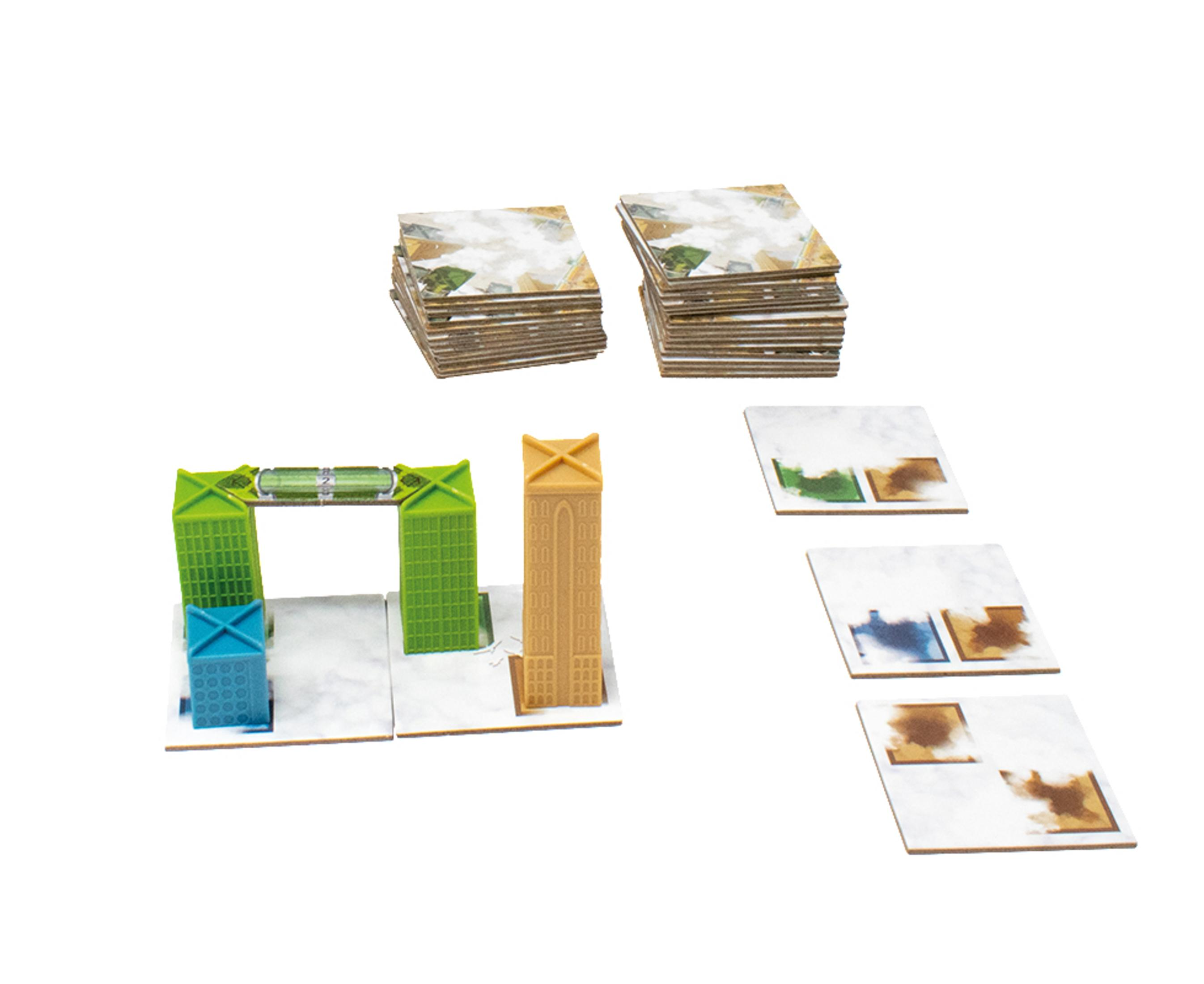 Ein Brettspiel-Setup mit gebäudeartigen Strukturen, modularen Kacheln und Pappteilen.