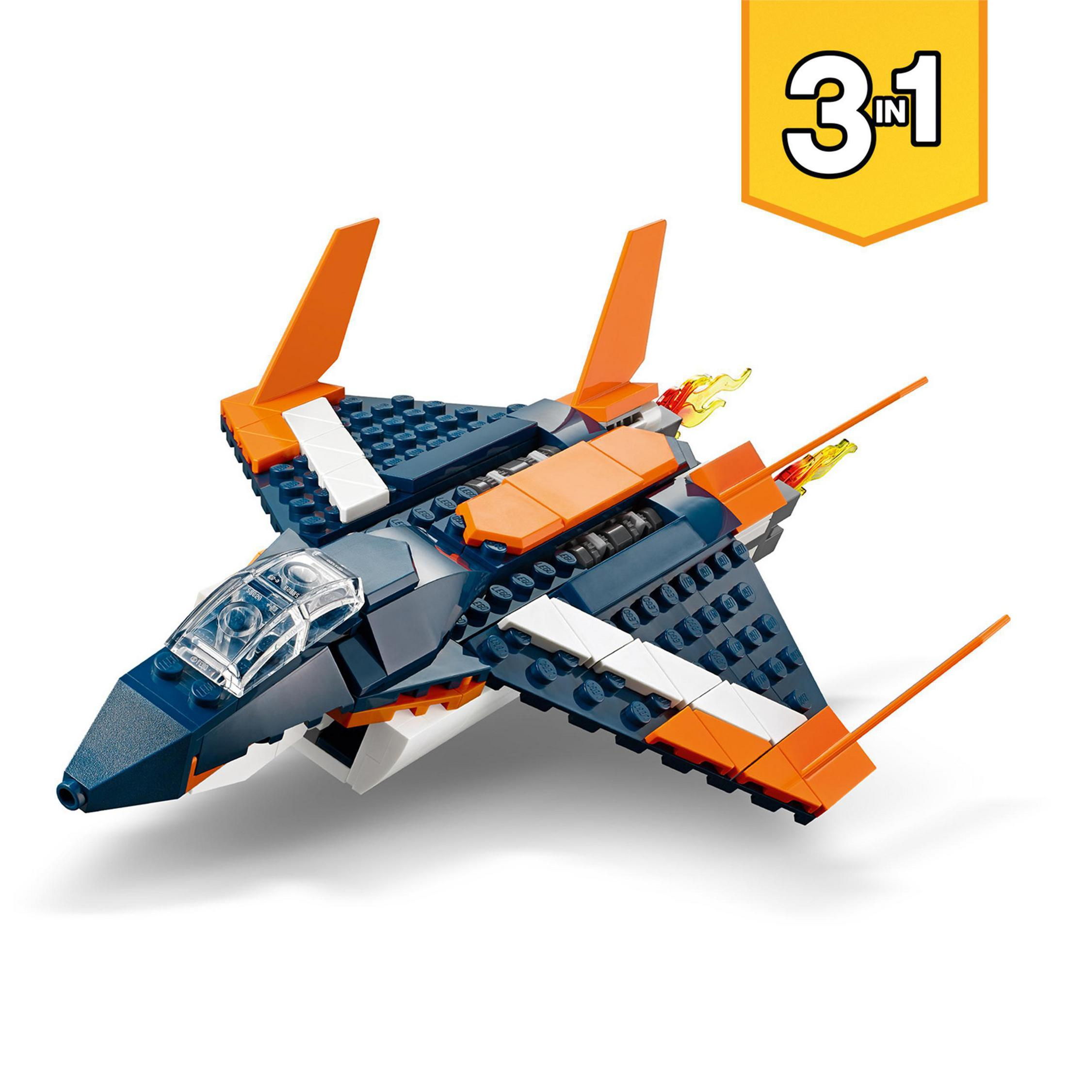 Avión de juguete azul, naranja y blanco con etiqueta amarilla '3 en 1'.