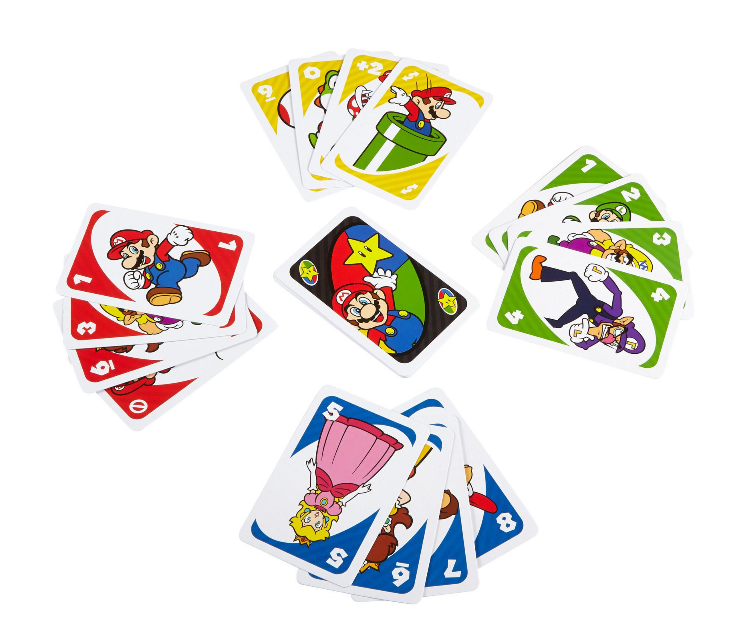 Jeu de cartes Uno avec des personnages de Mario. Les cartes sont étalées sur une surface blanche.