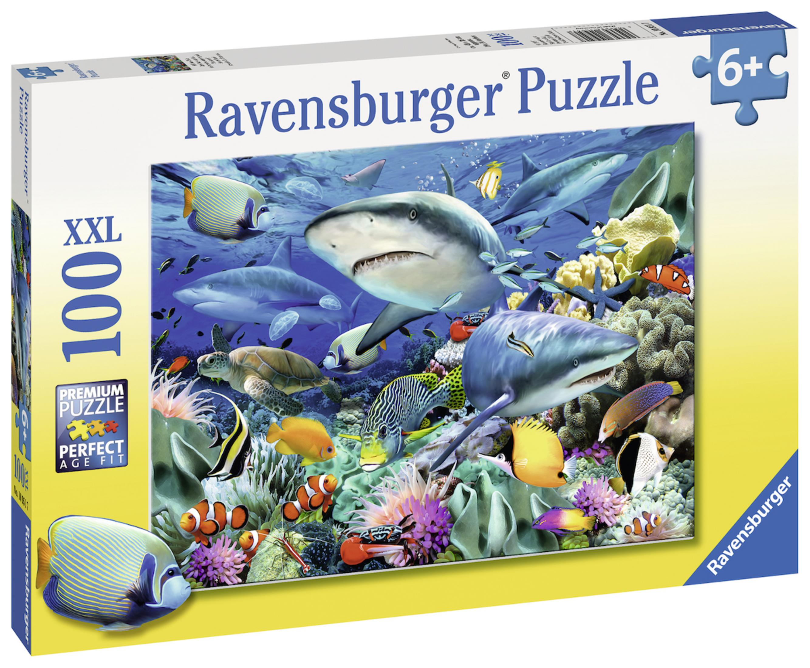 Scatola del puzzle Ravensburger. Il puzzle mostra vari pesci colorati e squali sott'acqua.