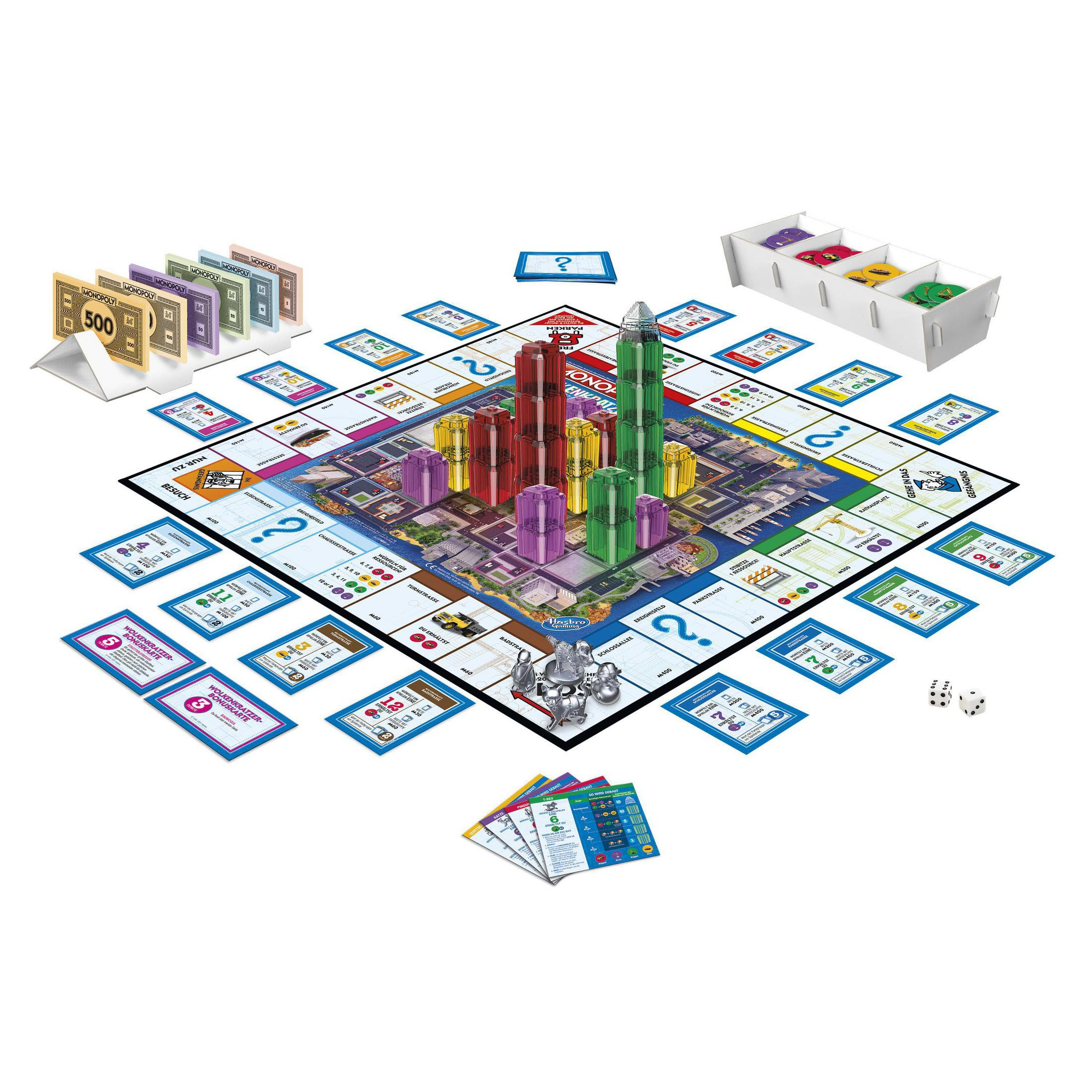 Monopoly-Spielaufbau. Das Brett ist mit Geld, Karten und Gebäuden aufgebaut, spielbereit.