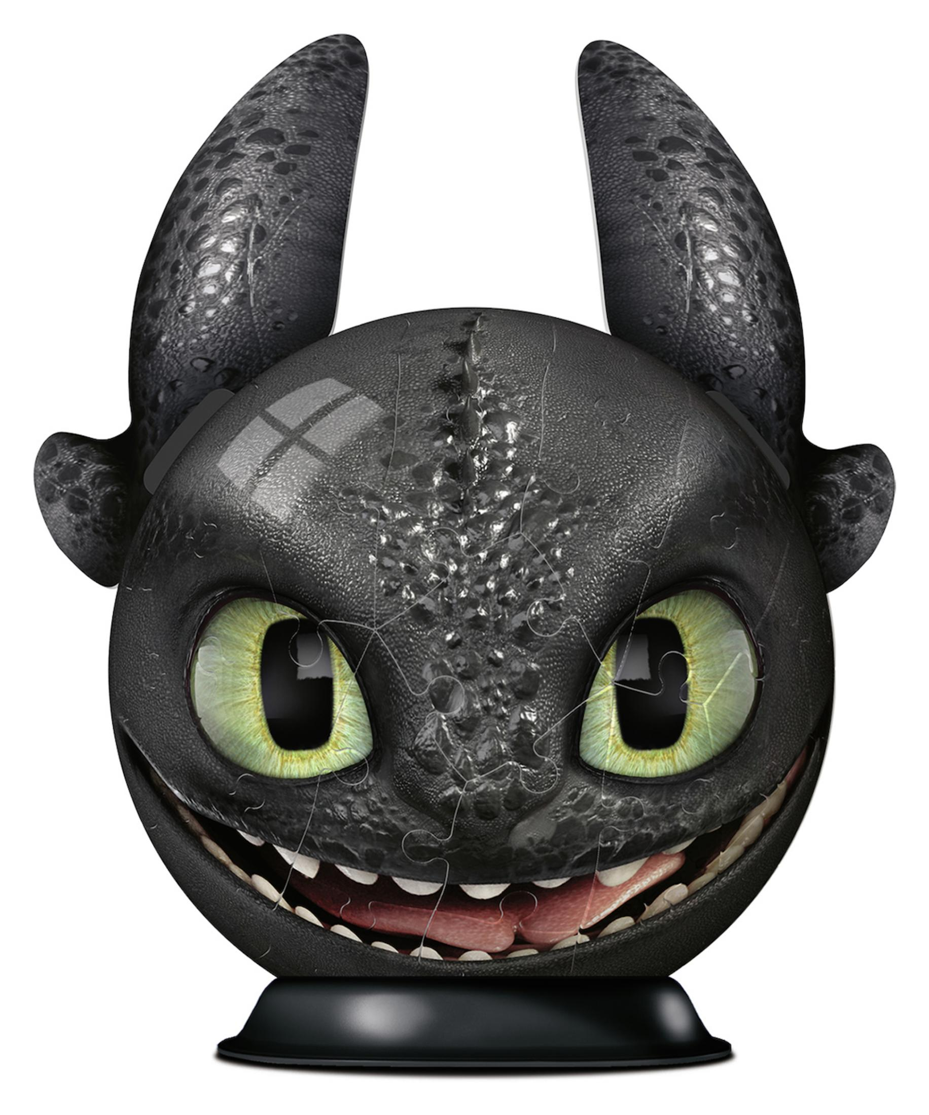 Zahnlose aus Drachenzähmen leicht gemacht Puzzle. Schwarzer Drachenkopf mit grünen Augen und breitem Grinsen.