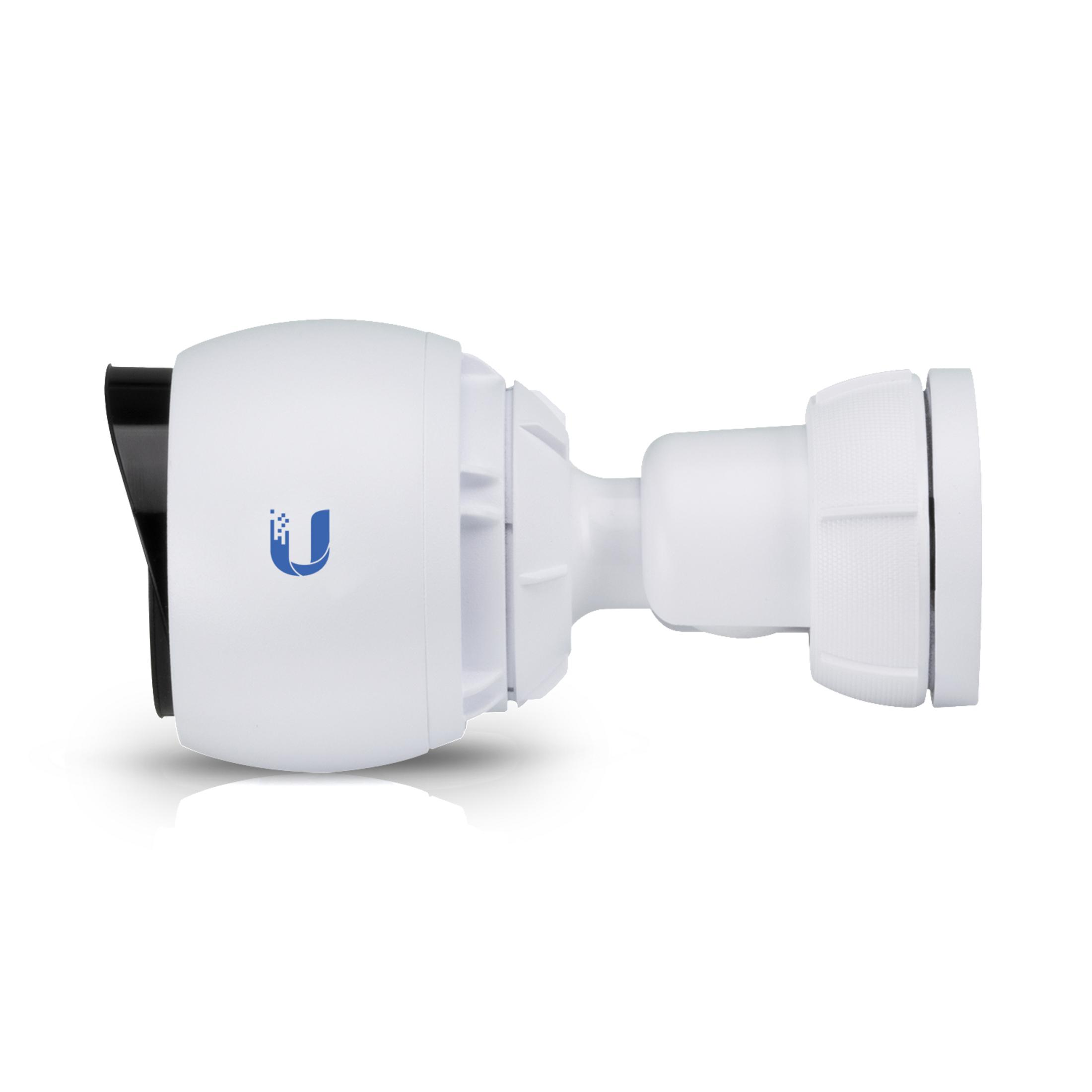 Biała kamera bezpieczeństwa z czarnym daszkiem, zamontowana na białej powierzchni.