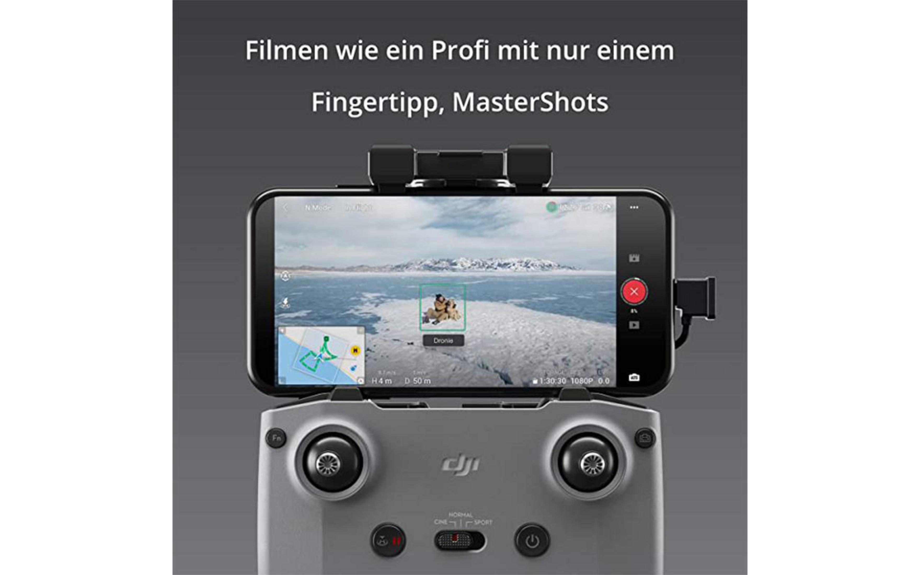 Smartphone auf Drohnen-Controller, der eine verschneite Landschaft zeigt.