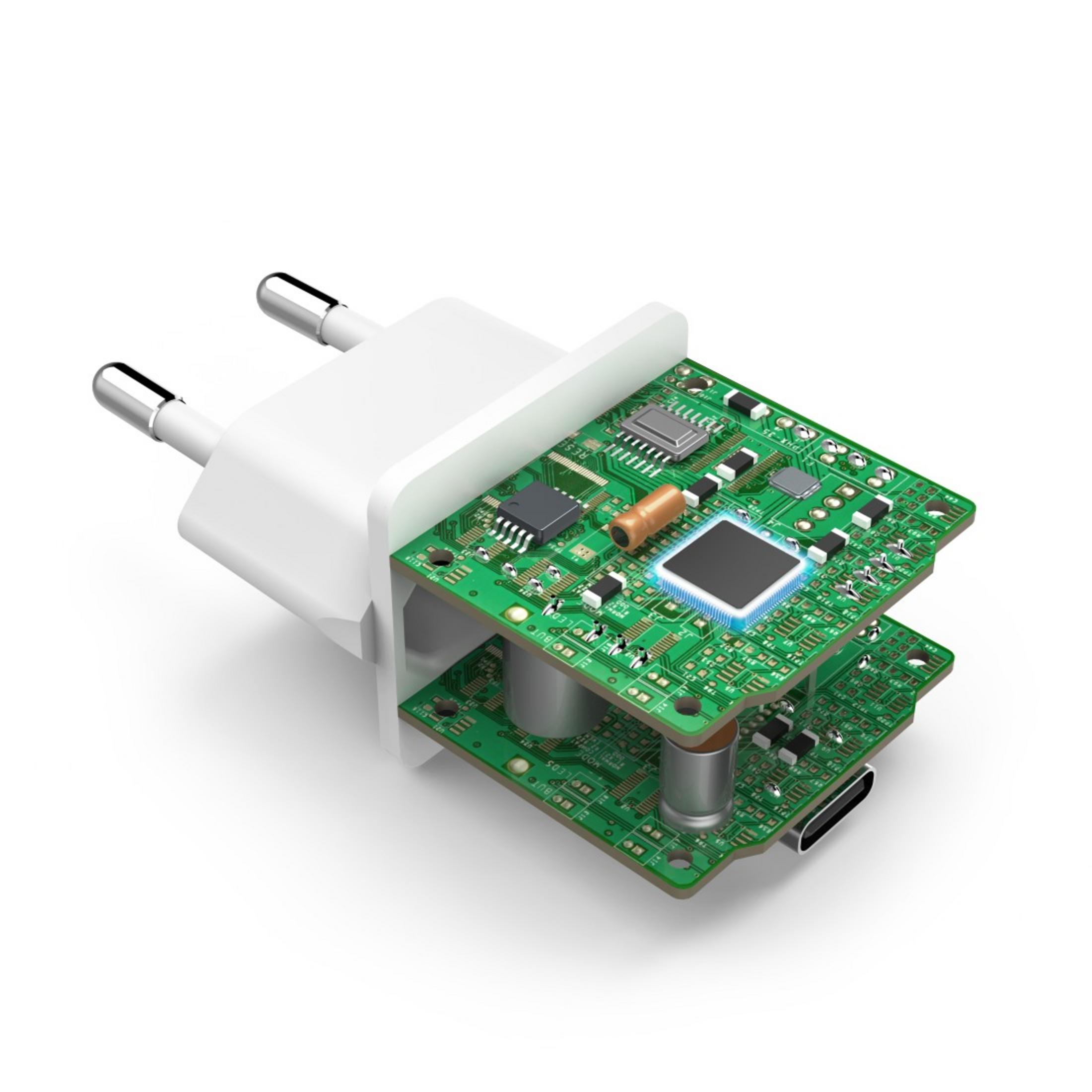 Biały zasilacz z widocznymi wewnętrznymi płytkami obwodów. Białe tło.