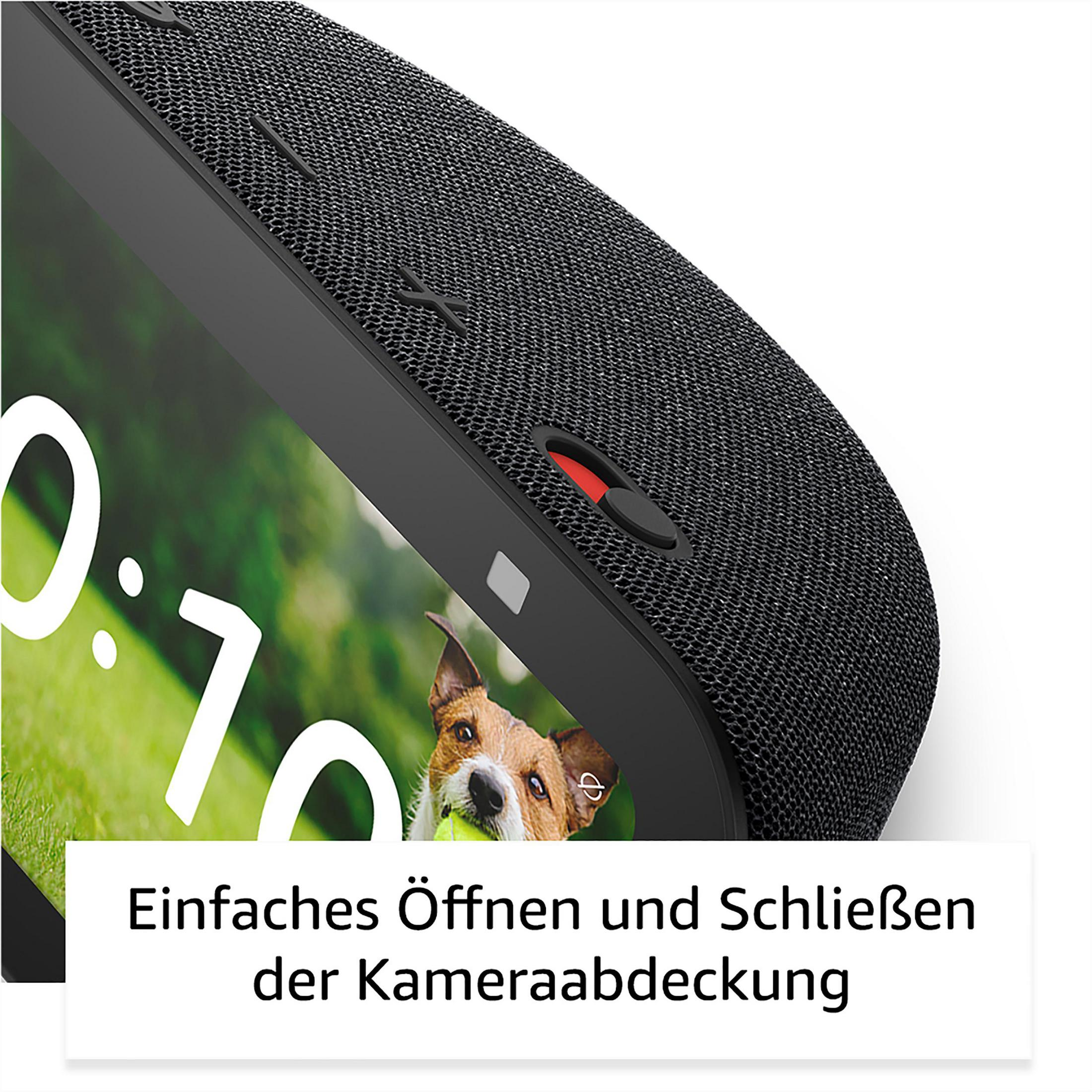 Zbliżenie czarnego urządzenia z ekranem pokazującym obraz psa. Tekst: 'Łatwe otwieranie i zamykanie'.