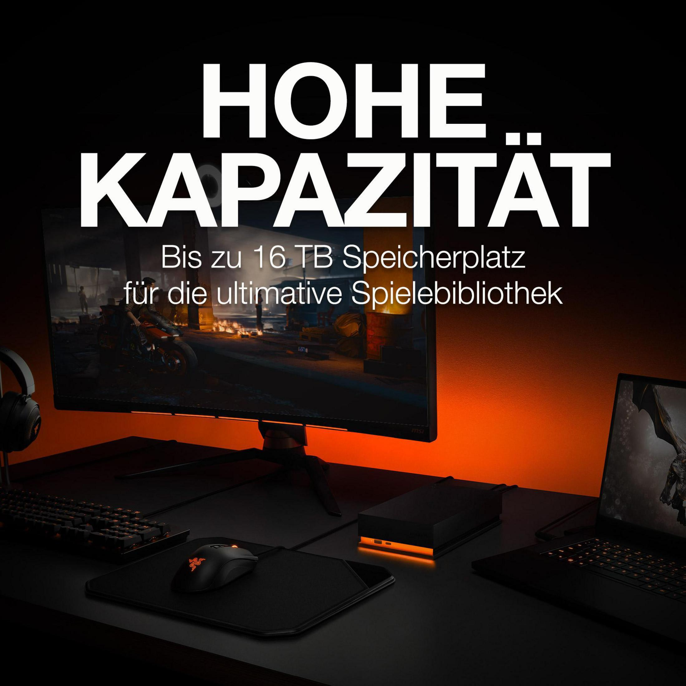 Konfiguracja do gier z monitorem, klawiaturą, myszą i czarnym zewnętrznym dyskiem twardym.