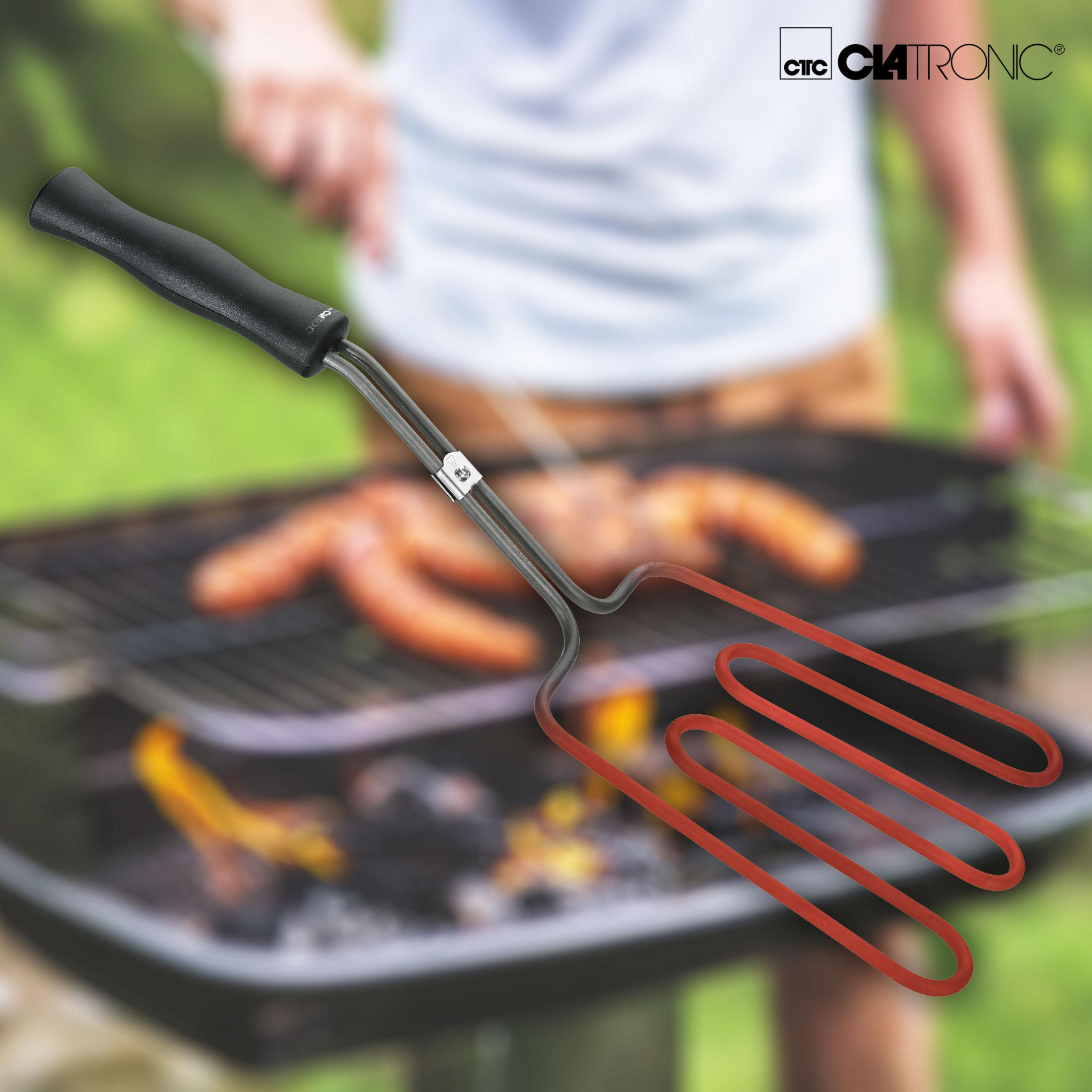 Narzędzie do grillowania z czarnym uchwytem i czerwonymi elementami grzejnymi, nad grillem.