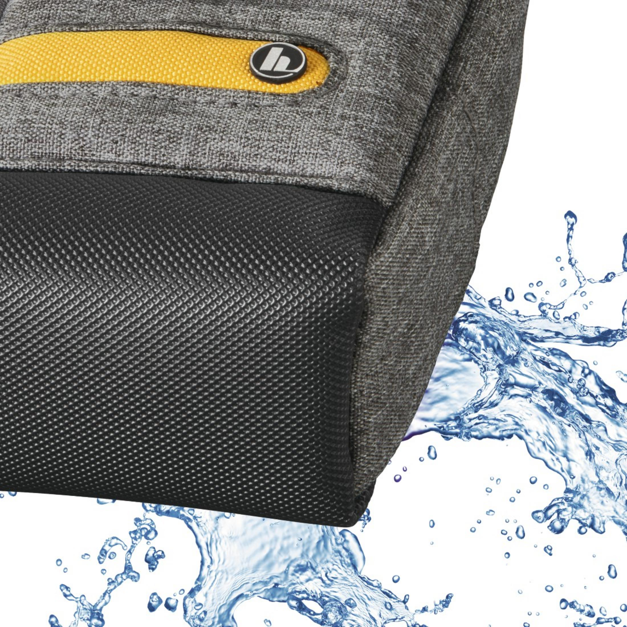 A grey and black bag with a yellow stripe. Water splashes in the foreground.