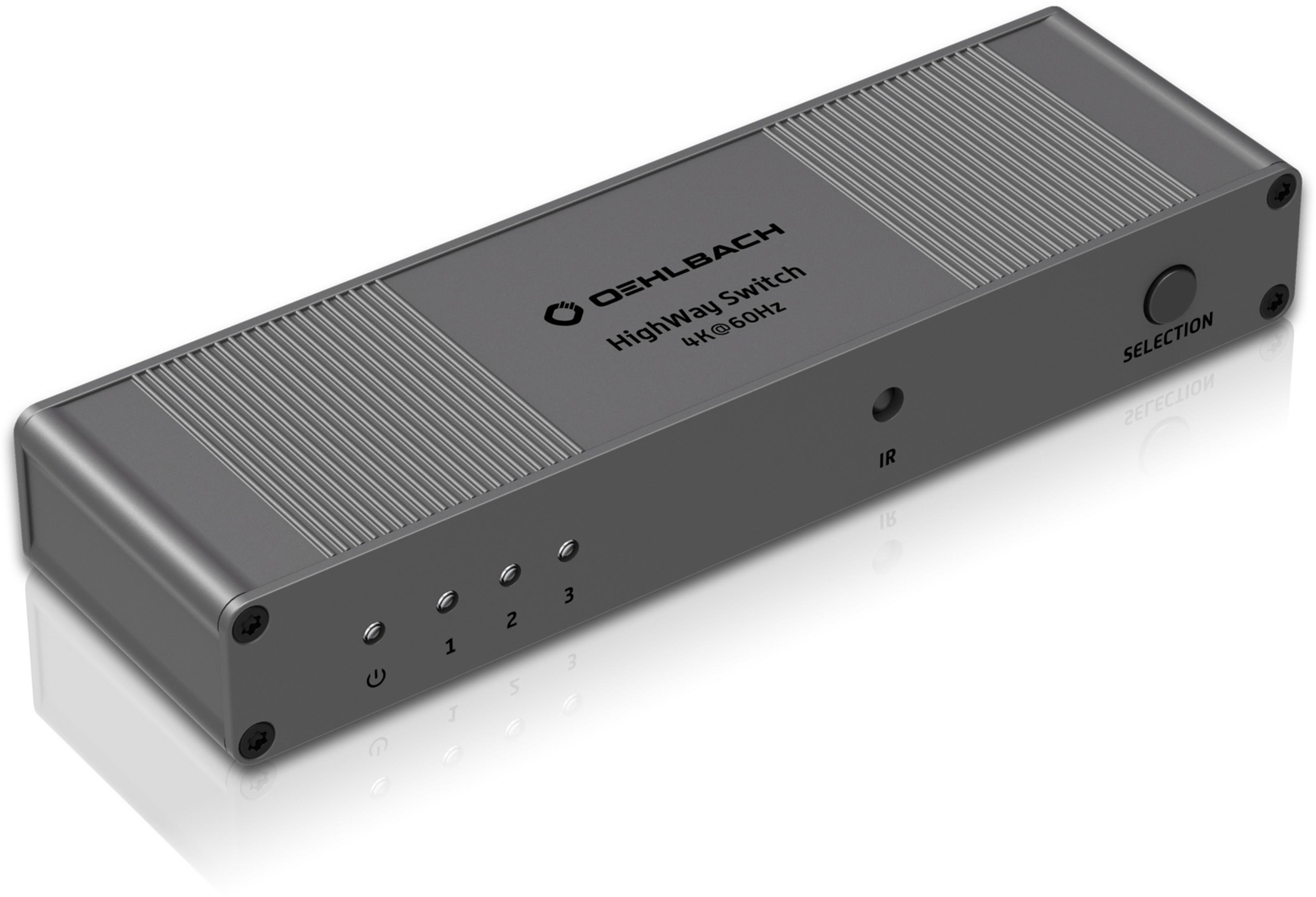 Ein schwarz-grauer Oehlbach HDMI-Switch mit drei Eingangstasten und einem IR-Sensor.
