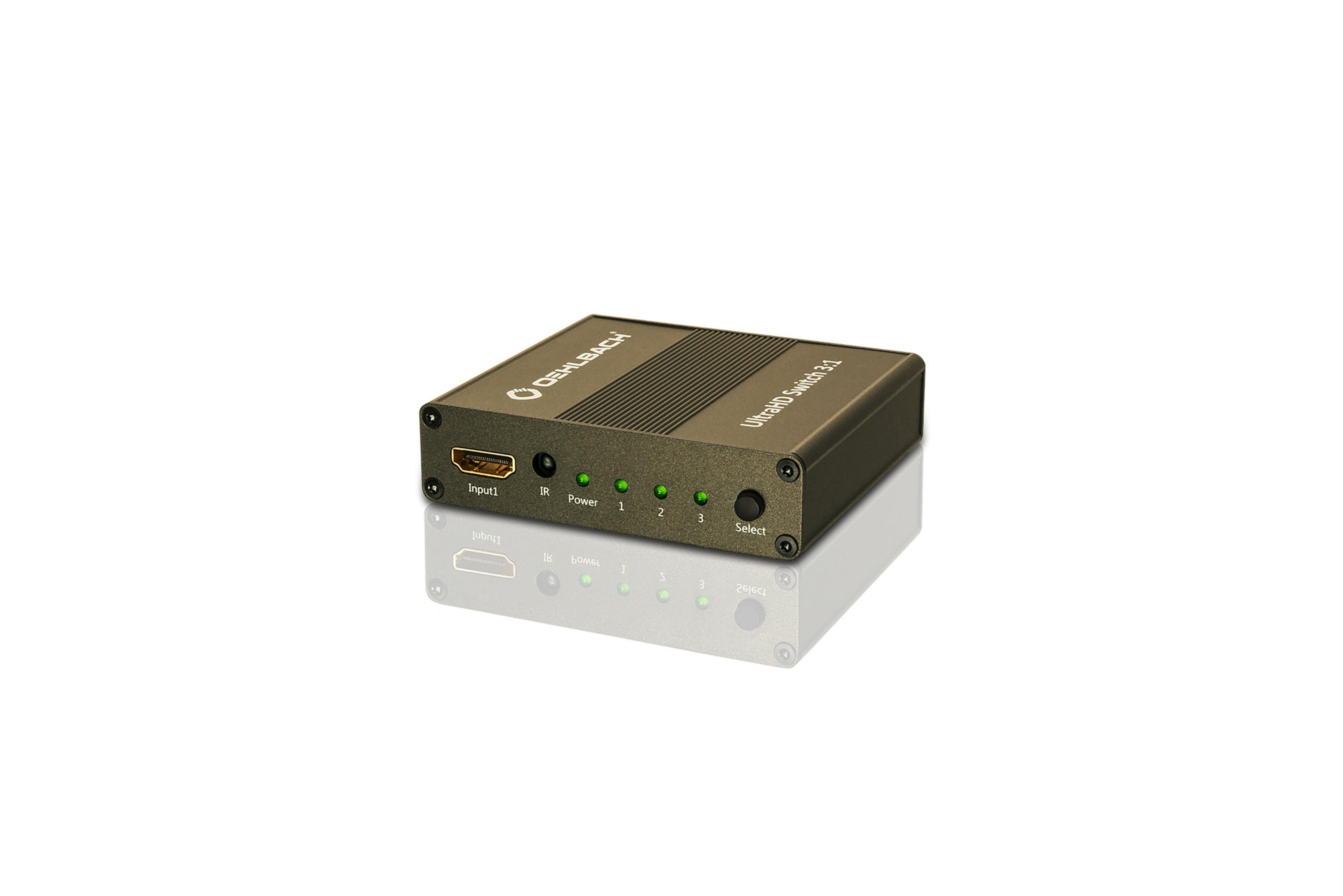 Ein schwarzer HDMI-Switch mit drei Eingangslichtern und einer Auswahltaste. Er befindet sich auf einer weißen Oberfläche.