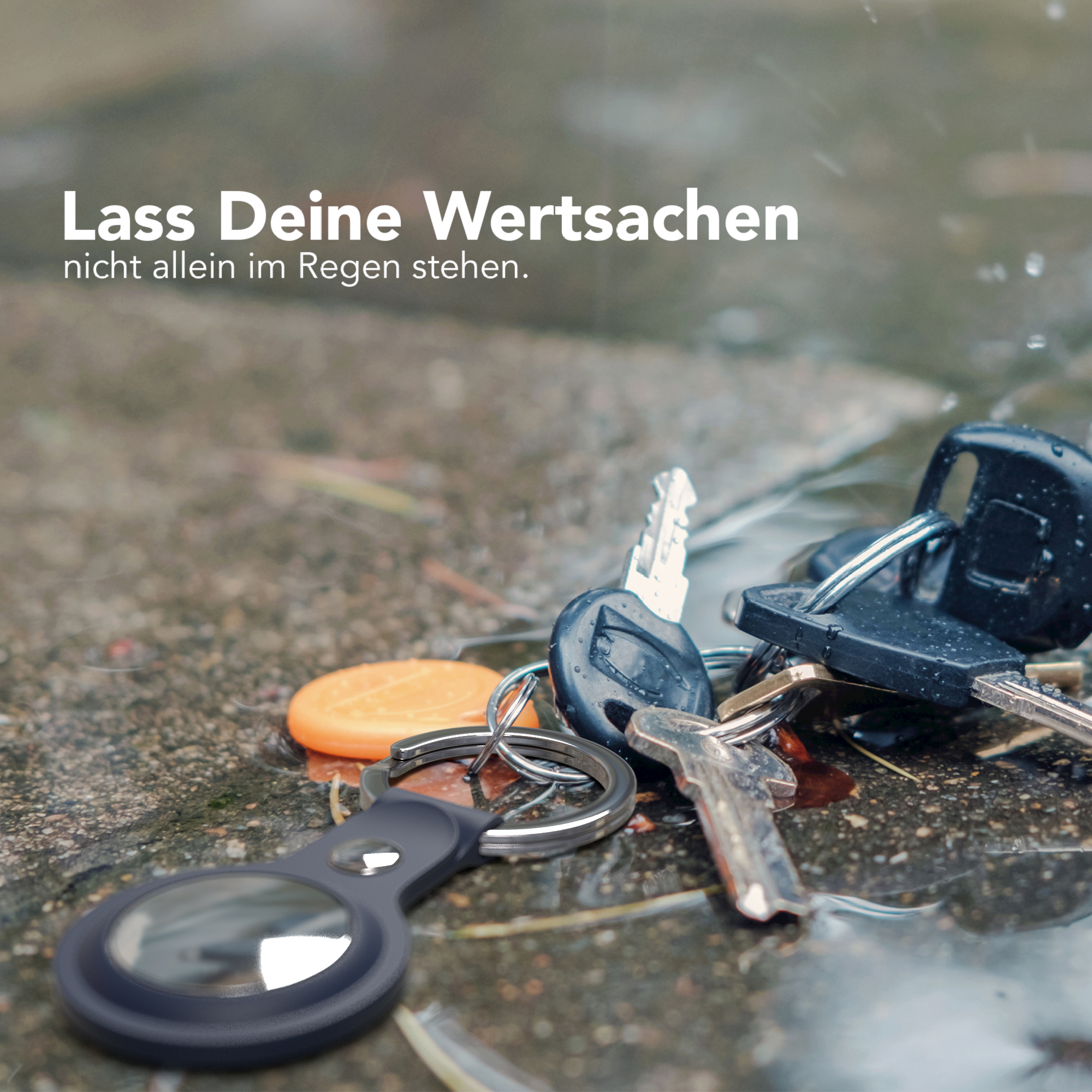 Schlüssel auf nasser Oberfläche, Text: Lassen Sie Ihre Wertsachen nicht im Regen stehen.
