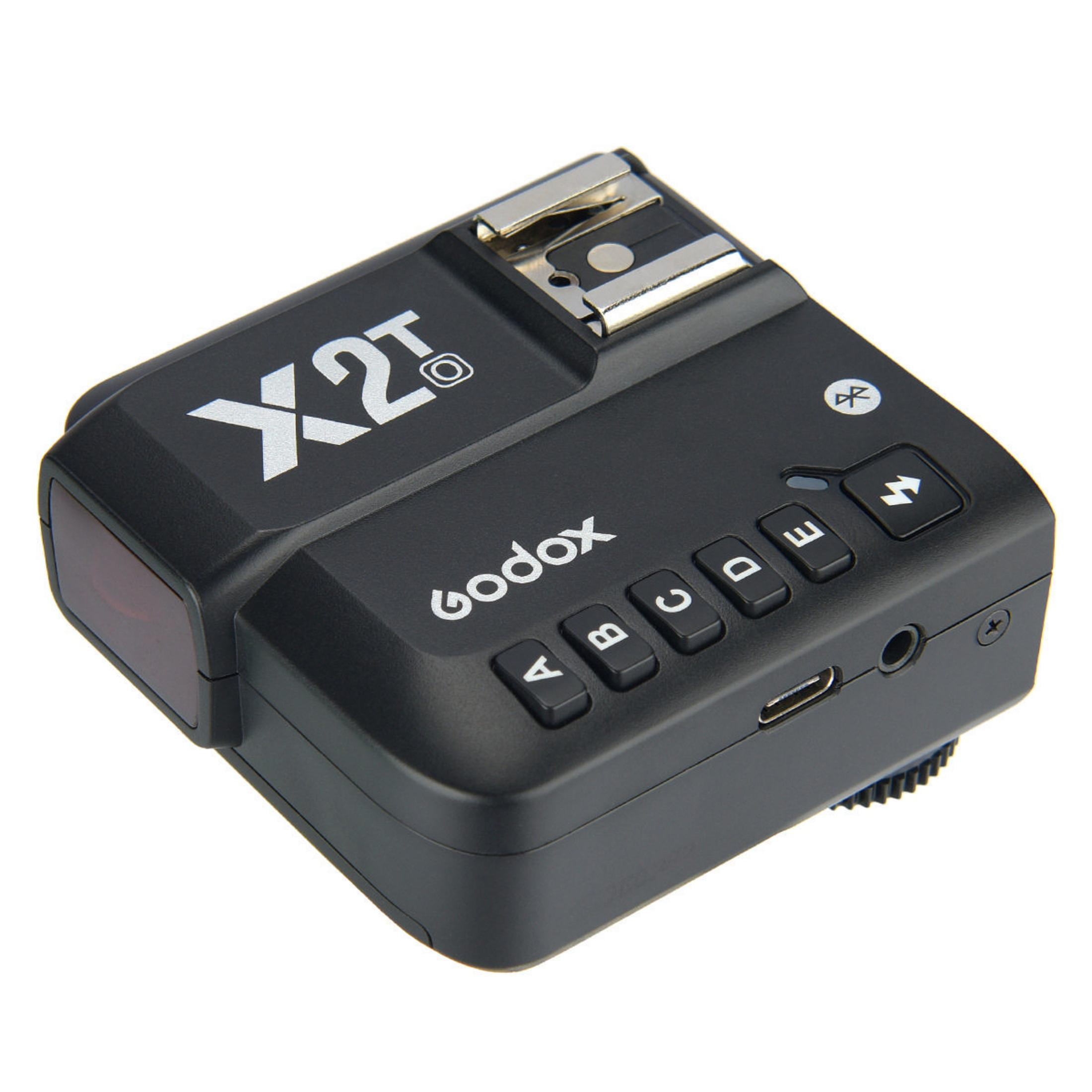 Disparador Godox X2T negro para flash de cámara. Tiene botones, una pantalla y un puerto.
